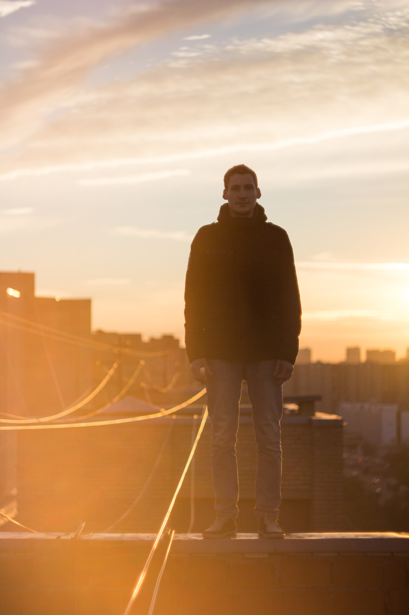 Canon EF 35-80mm f/4-5.6 sample photo. Man on rooftop sunset photography