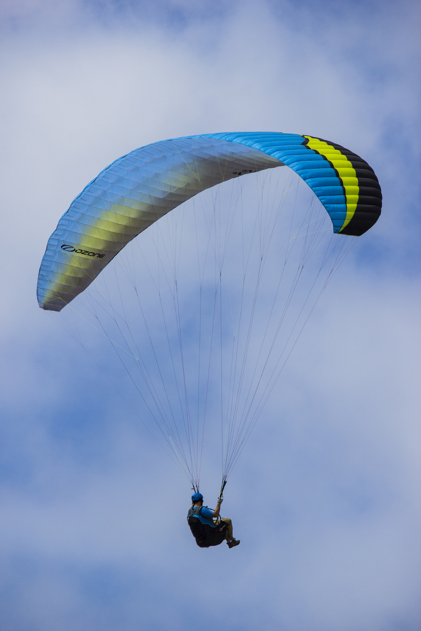 Canon EF-S 55-250mm F4-5.6 IS sample photo. Para-glider in flight over the ocean photography