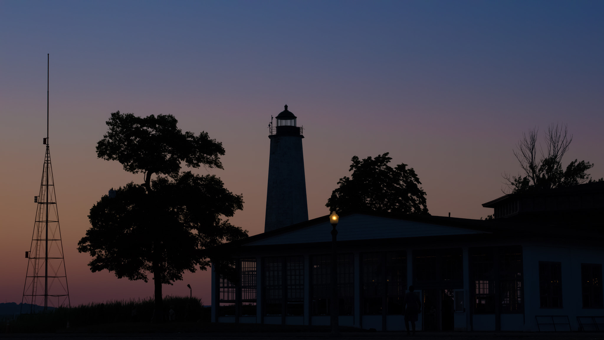 Panasonic Lumix DMC-GH2 + Olympus M.Zuiko Digital 45mm F1.8 sample photo. Lighthouse at sunset photography