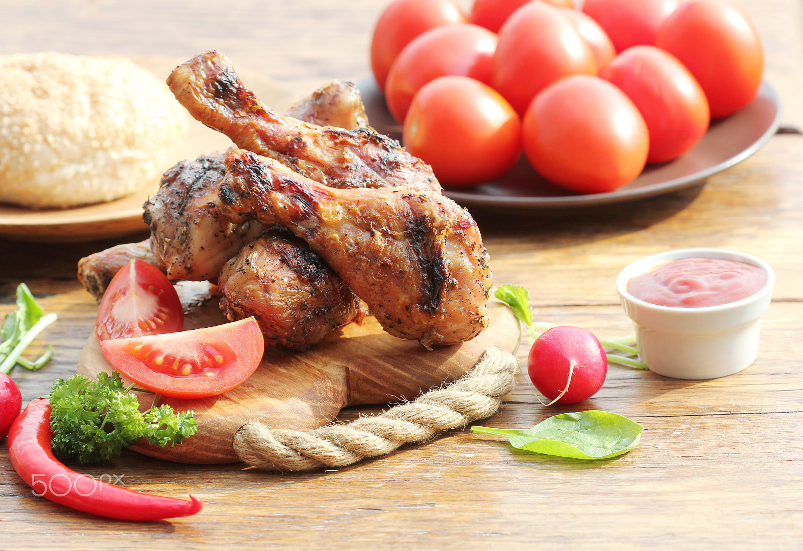 Canon EF 100mm F2.8 Macro USM sample photo. Grilled chicken legs with vegetables on cutting board. photography
