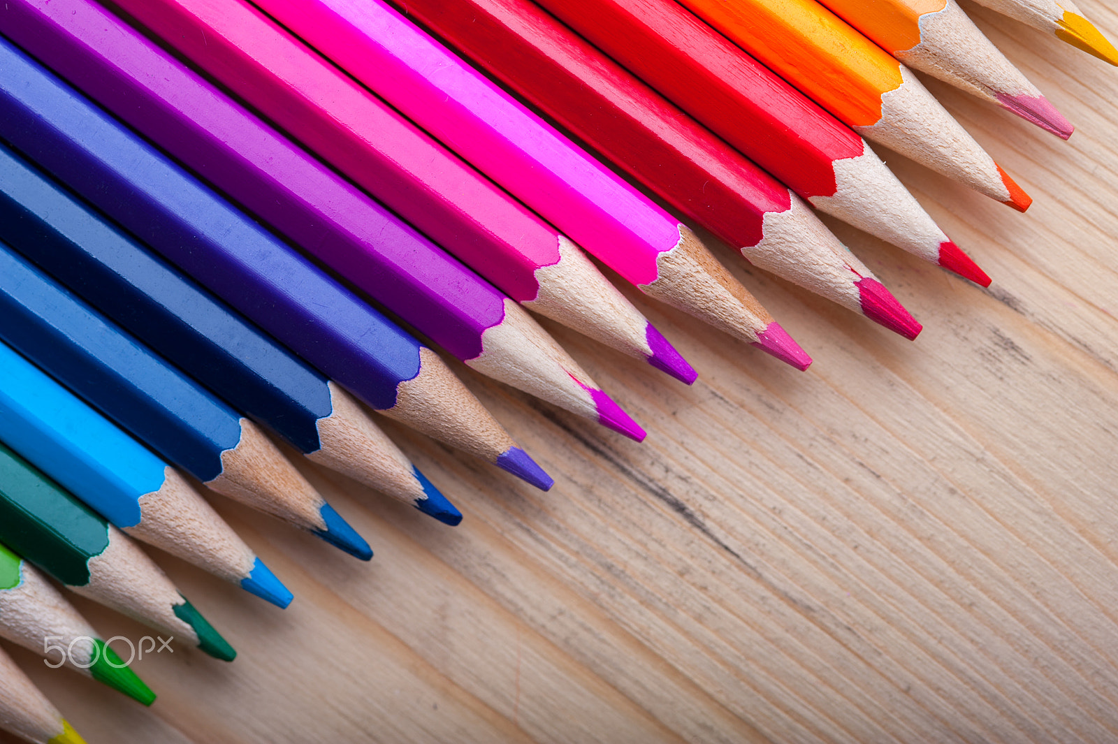 Nikon D700 sample photo. Multicolored pencils on wooden table, top view. photography