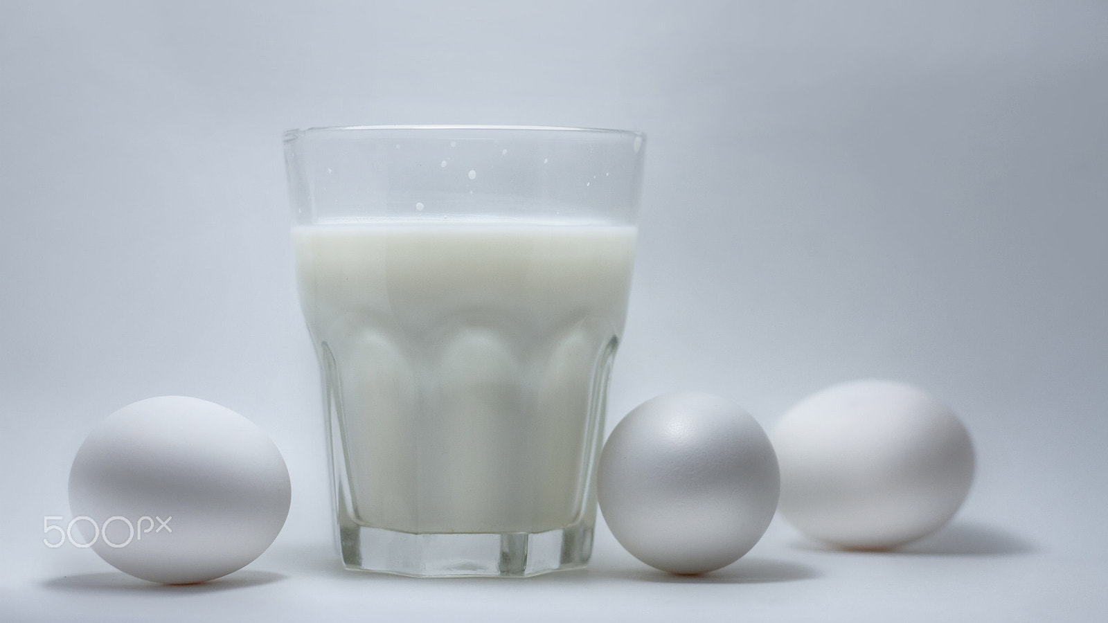 Canon EOS 7D + Canon EF 50mm F1.8 STM sample photo. Milk in a glass jar and eggs photography