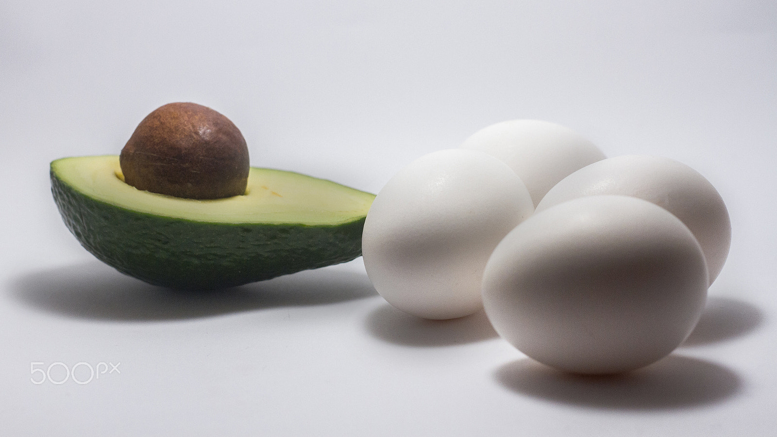 Canon EOS 7D sample photo. Avocado egg white background photography
