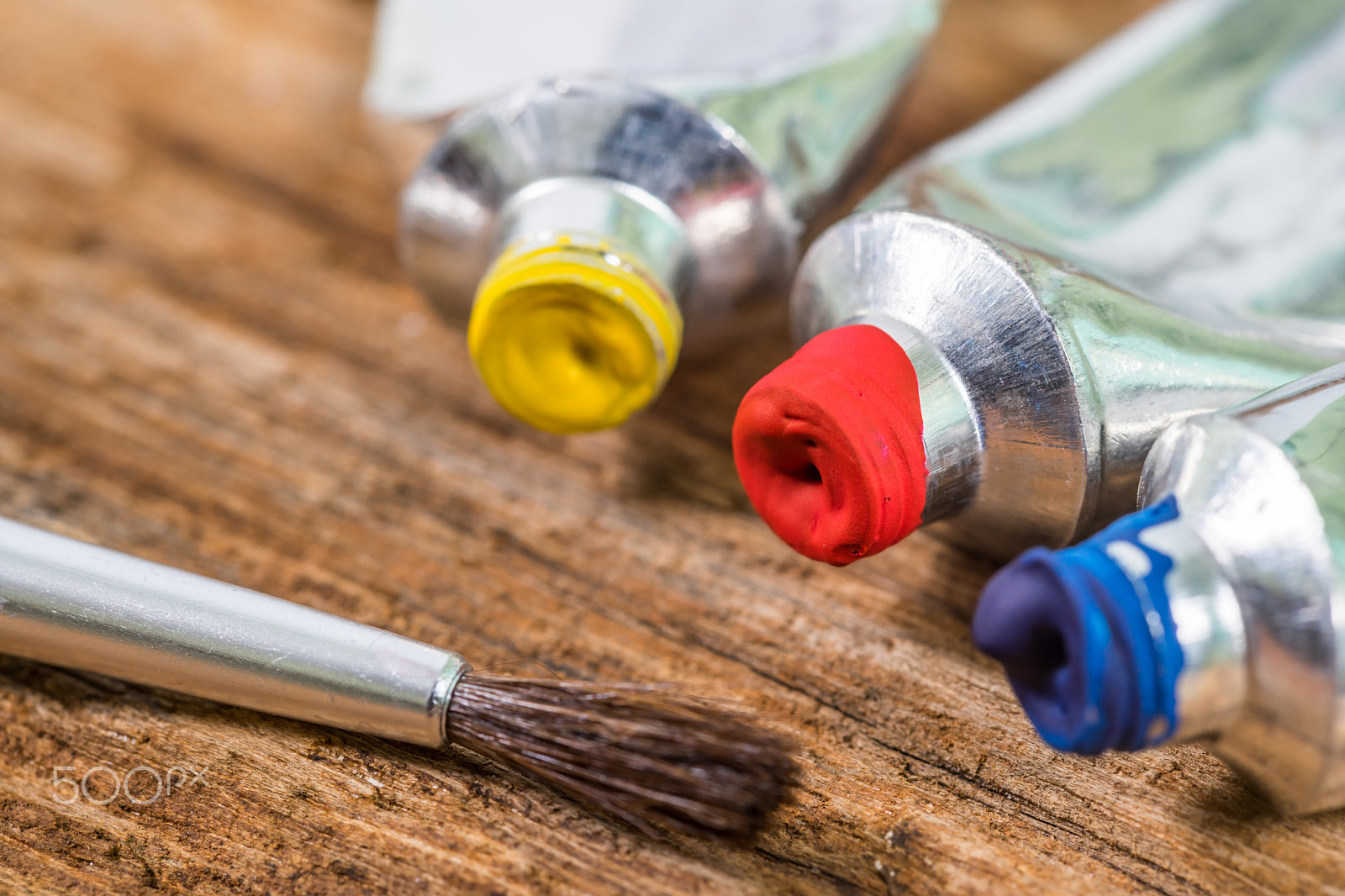 Sony a7 II + Tamron 18-270mm F3.5-6.3 Di II PZD sample photo. Close up of yellow,red,blue, tempera color with paint brush on wood texture background. photography