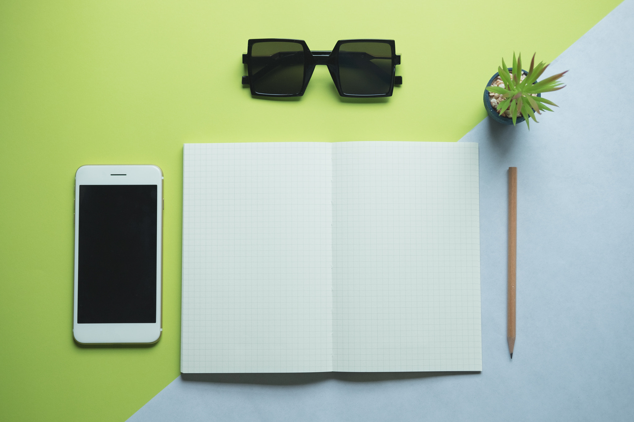 Fujifilm X-T10 + Fujifilm XF 35mm F2 R WR sample photo. Flat lay of minimal workspace desk with smartphone photography