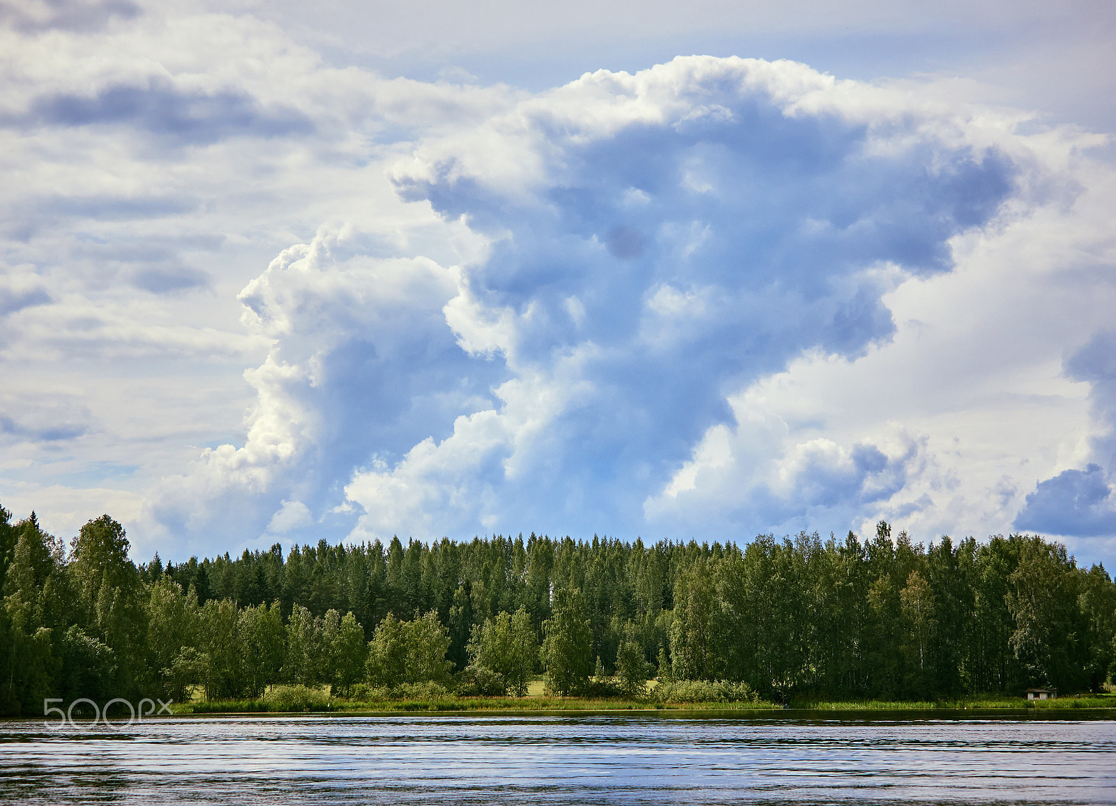 Olympus OM-D E-M5 II + Olympus M.Zuiko Digital ED 40-150mm F2.8 Pro sample photo. Majestic thunder clouds forming in the bright summer day sky in finland photography