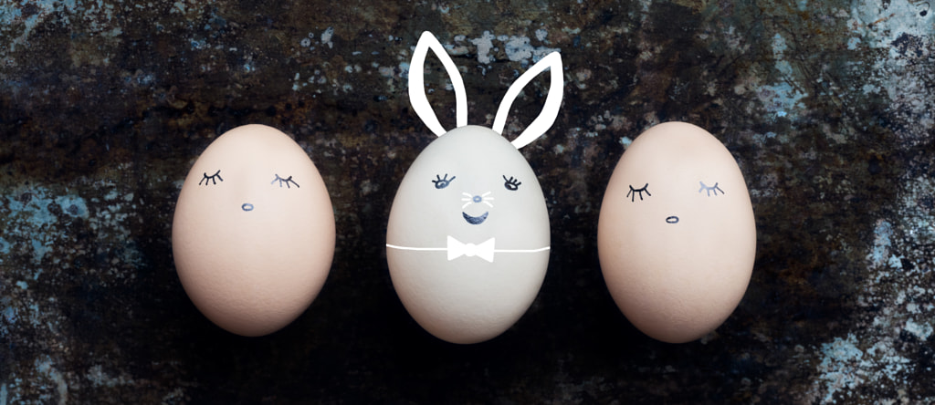 Three cute easter eggs with faces, happy easter bunny retro background by Andrea Obzerova on 500px.com