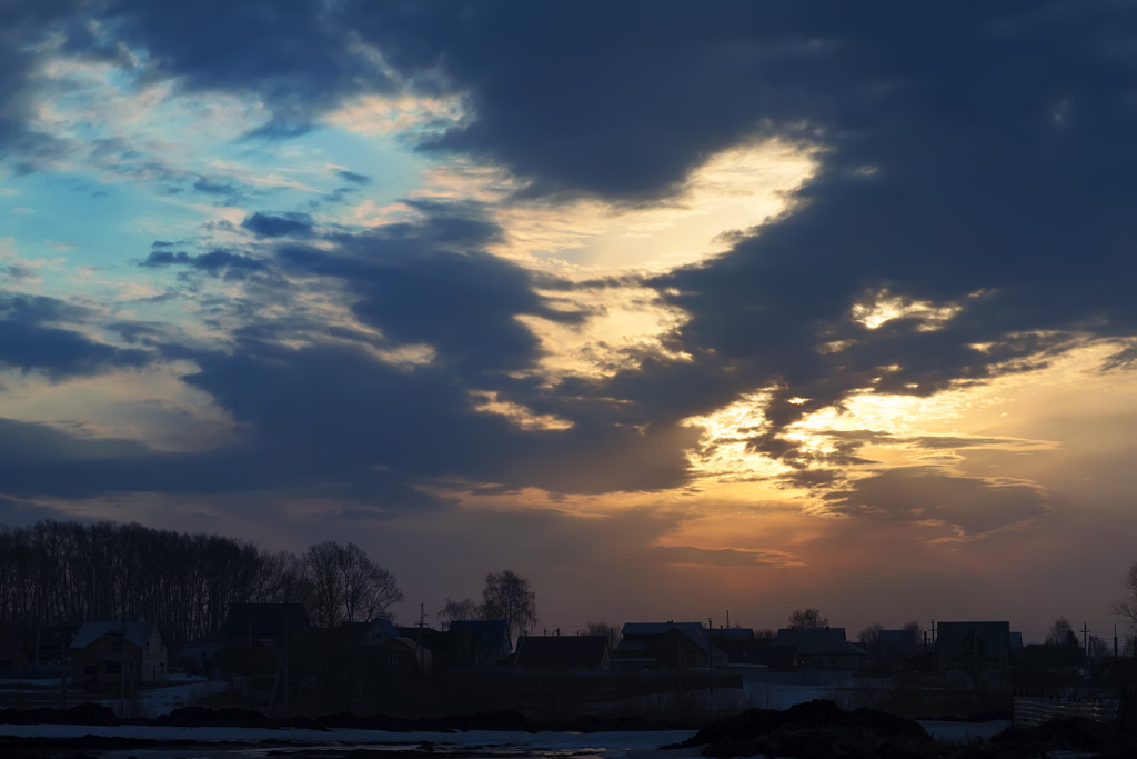 Sunrise and clouds over the village