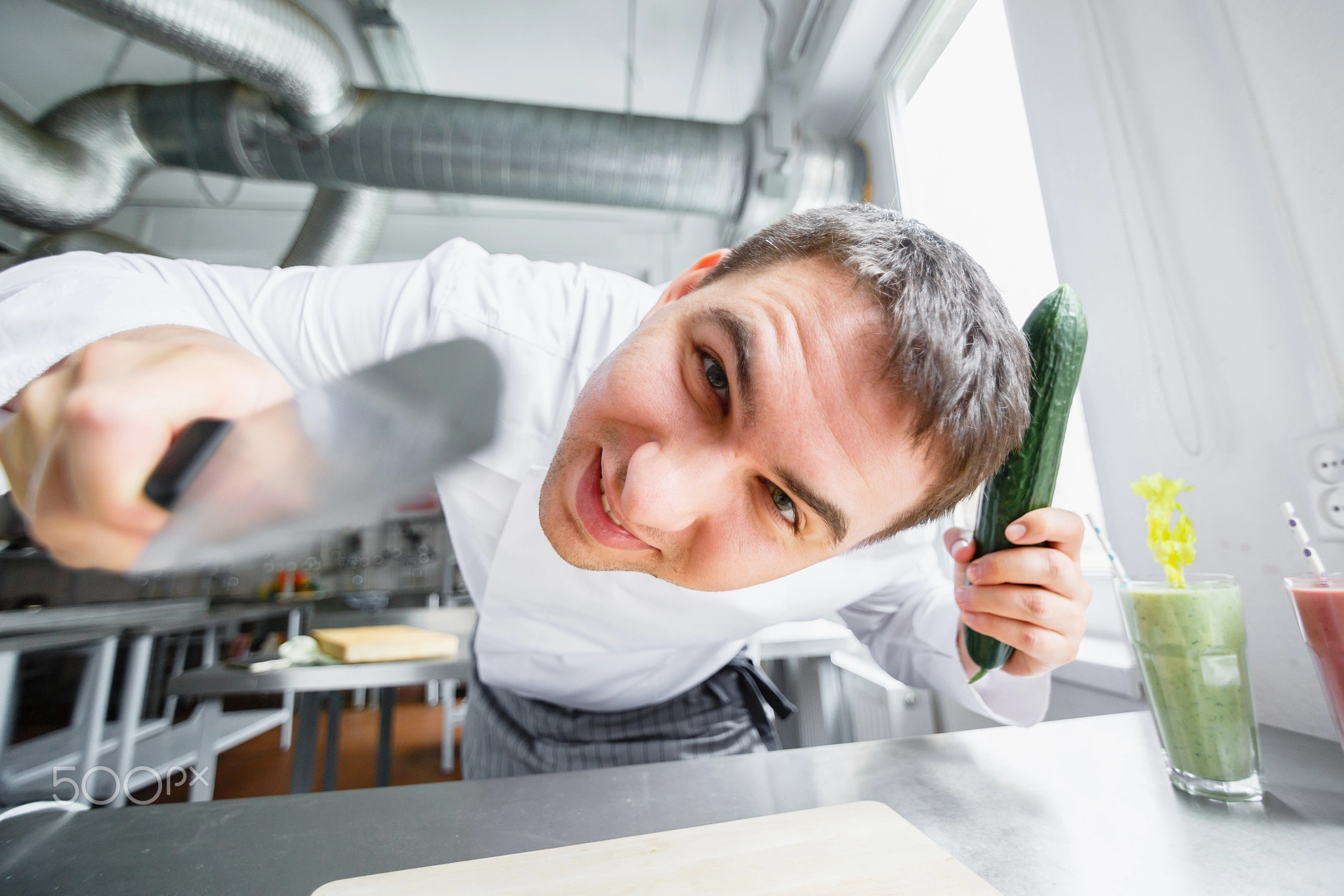 Young male chef having fun