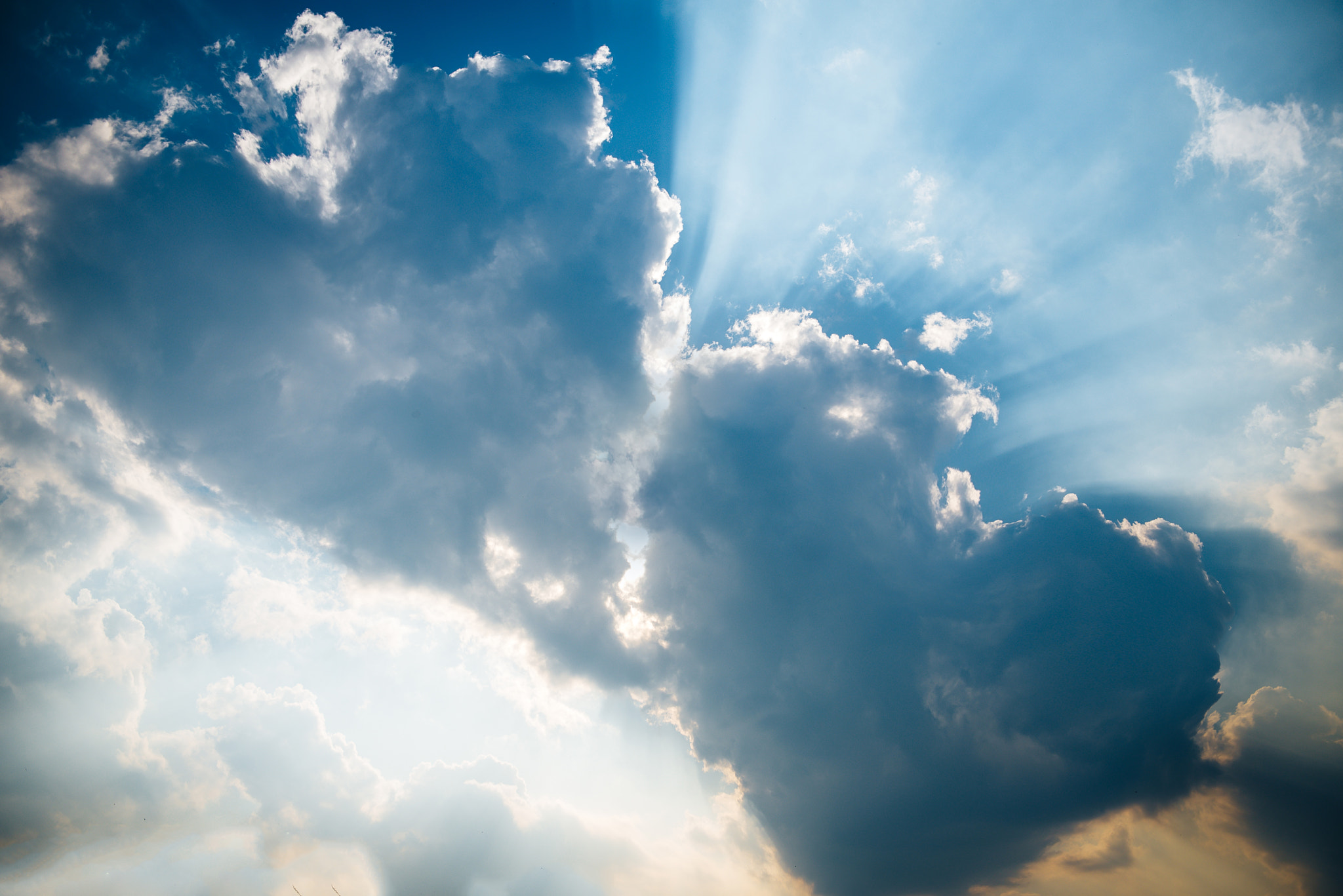 Nikon AF-S Nikkor 24-70mm F2.8G ED sample photo. It is three heart shaped clouds on blue sky. photography