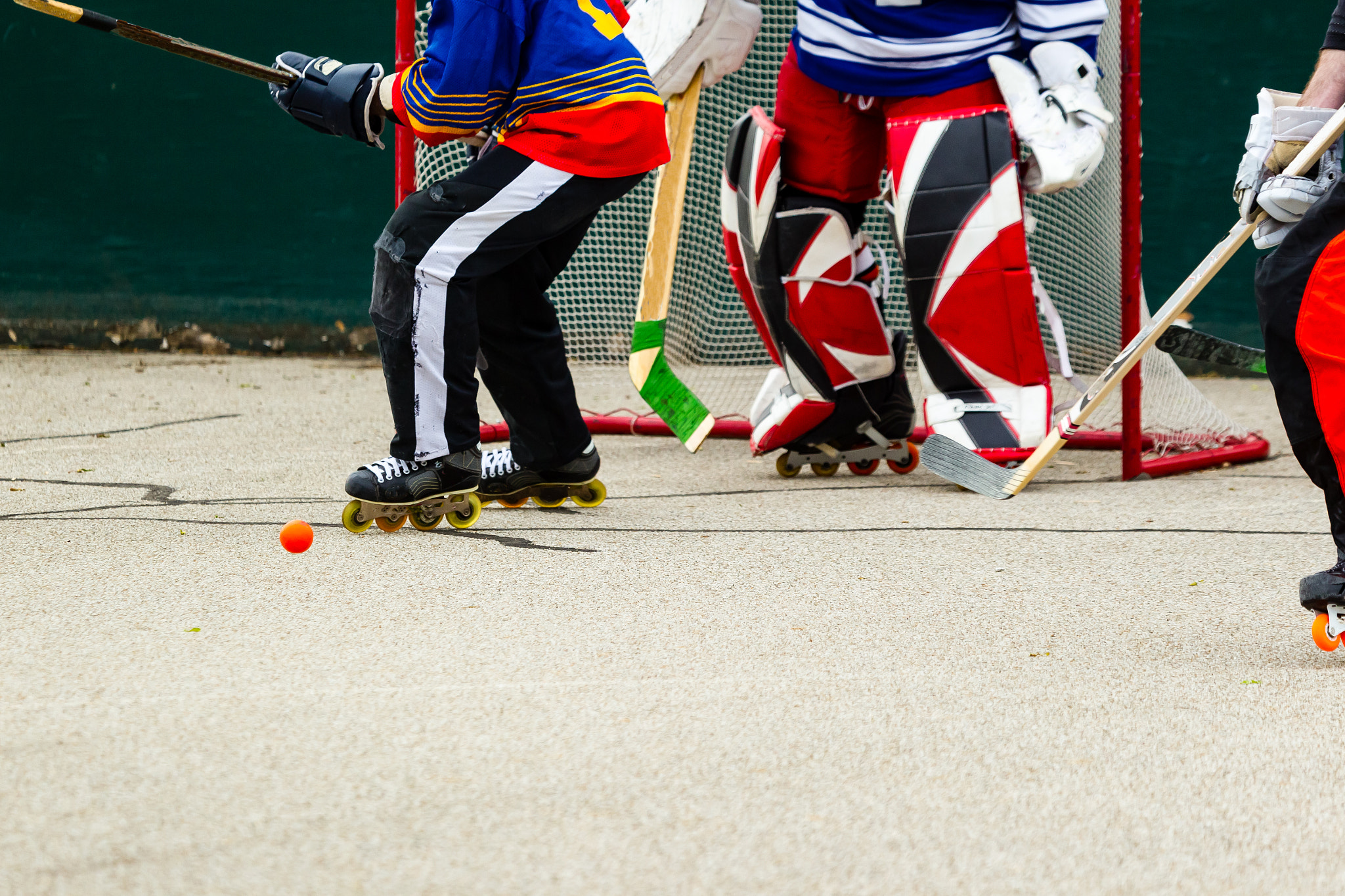 Canon EF 100-400mm F4.5-5.6L IS USM sample photo. Hockey players scramble in front of the goal photography