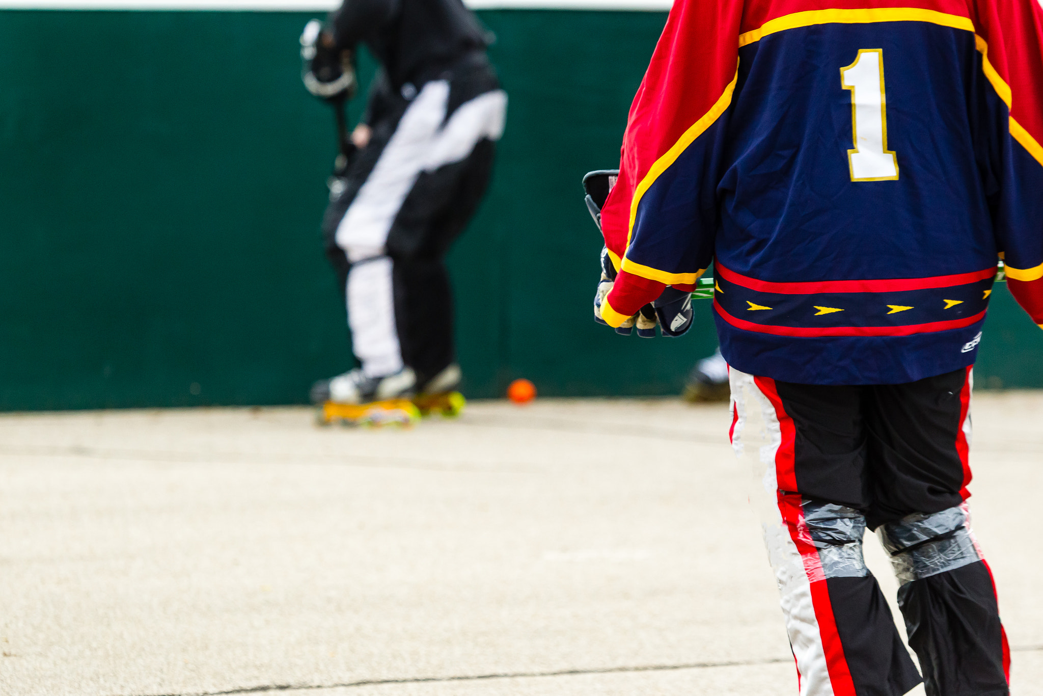 Canon EF 100-400mm F4.5-5.6L IS USM sample photo. Hockey player watching the play in front of him photography