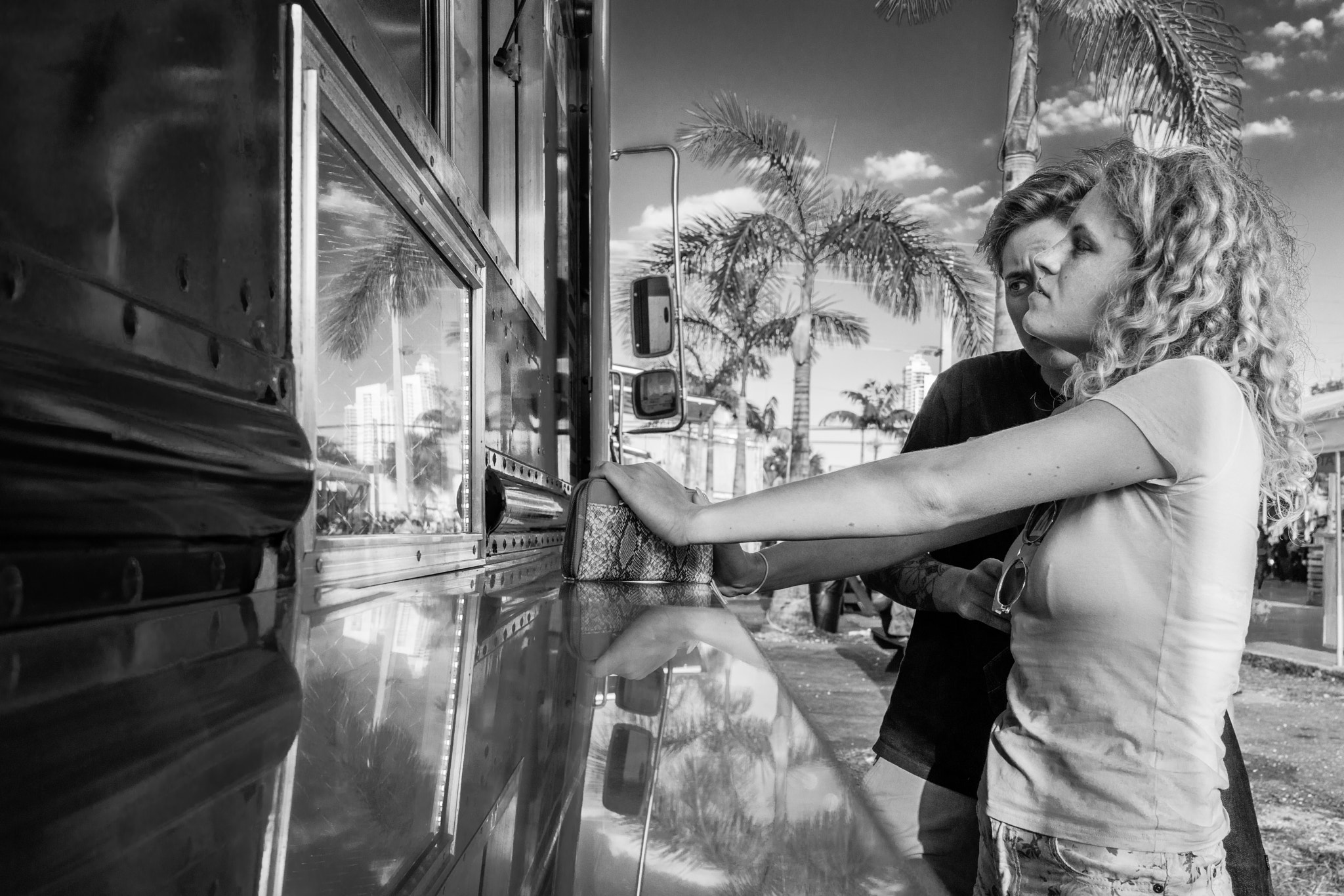 Sony Cyber-shot DSC-RX1R II + 35mm F2.0 sample photo. People of miami - tropical reflections... photography