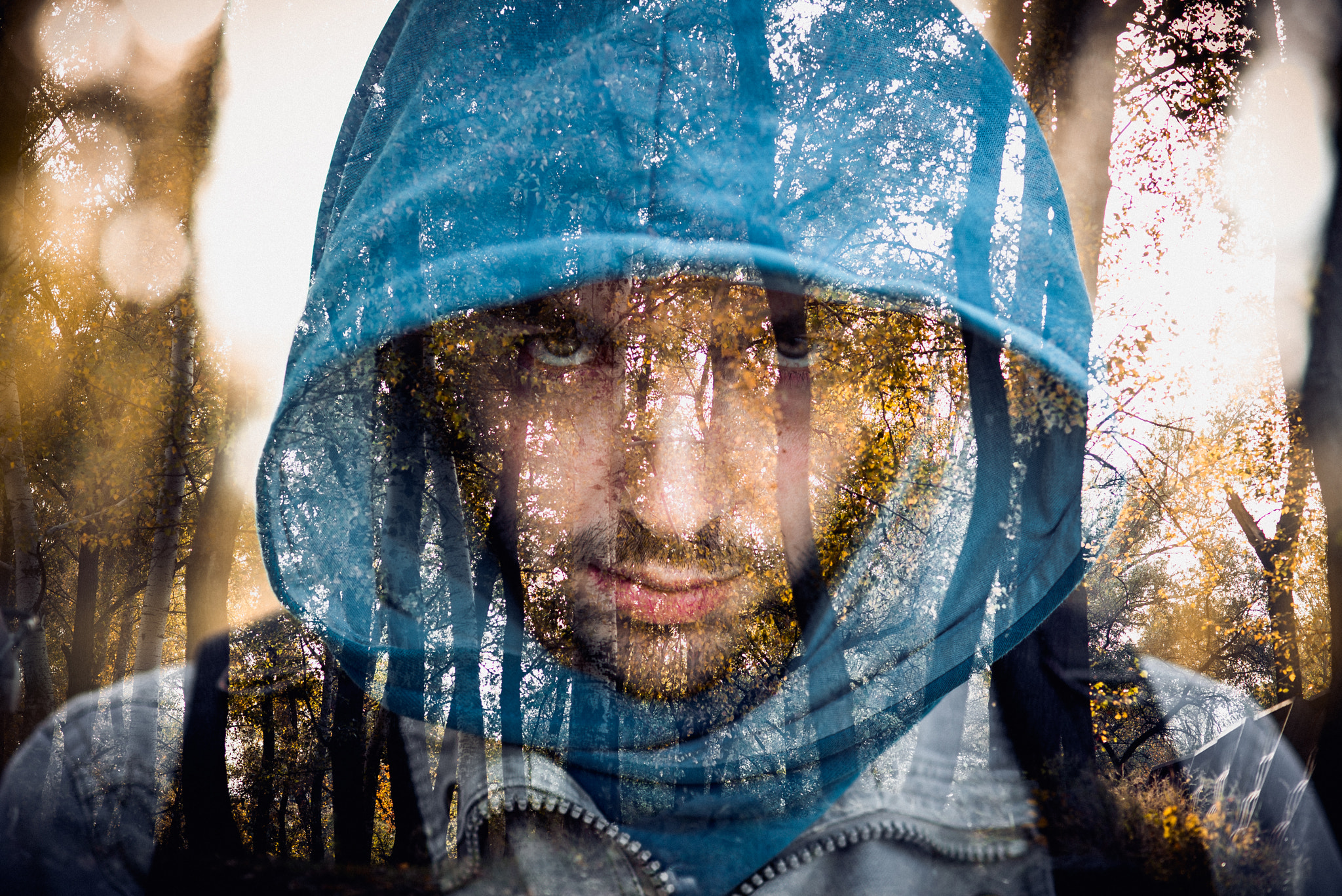 Nikon D610 + Nikon AF Nikkor 85mm F1.8D sample photo. Close-up portrait of threatening gangster wearing a hood, concept of danger photography