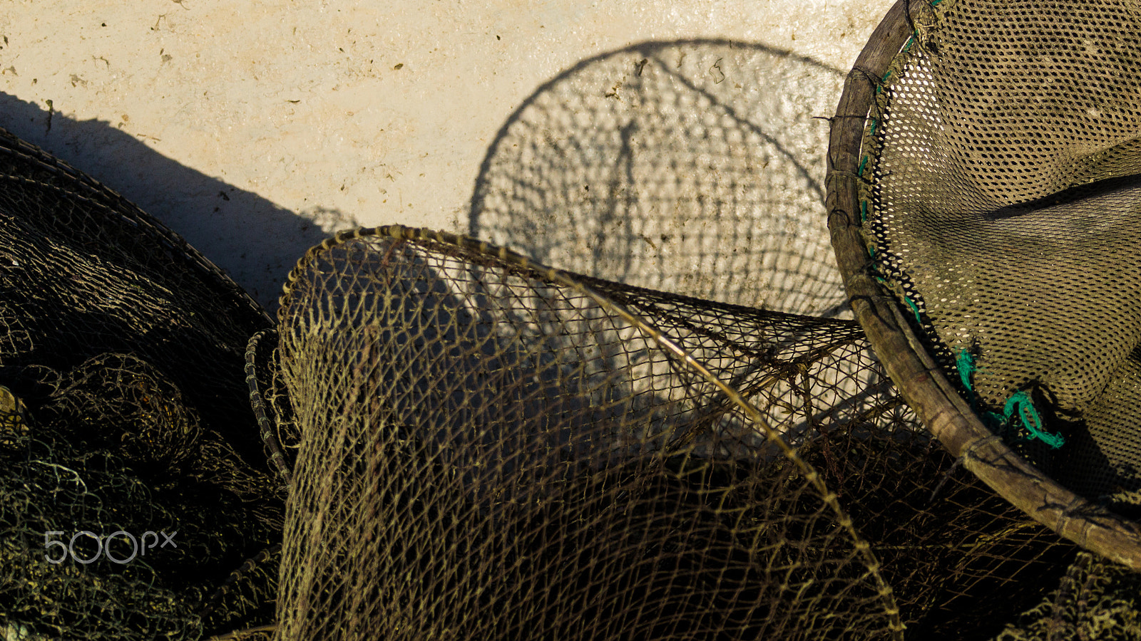 Sony 70-300mm F4.5-5.6 G SSM sample photo. Shadow of fishing nets photography