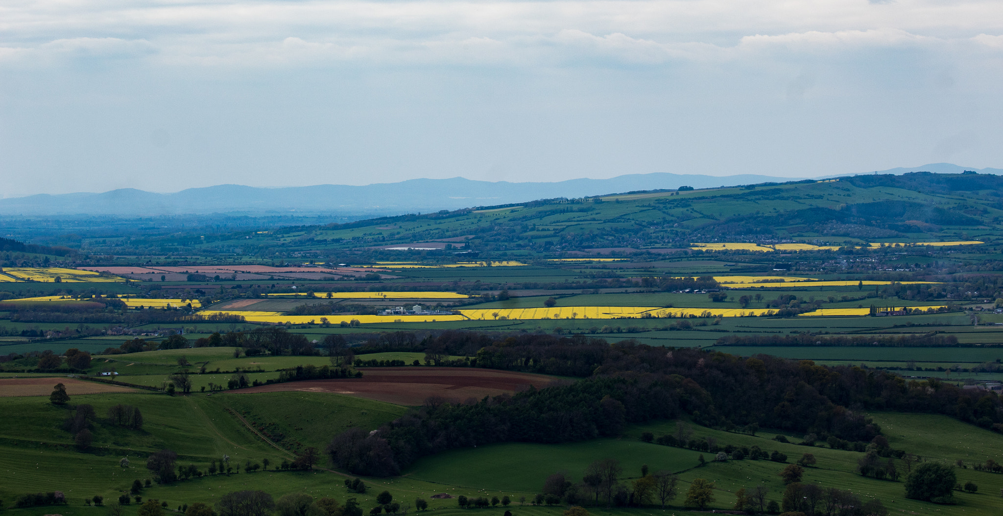 Canon EF 70-300mm F4-5.6 IS USM sample photo. Green and yellow fields photography