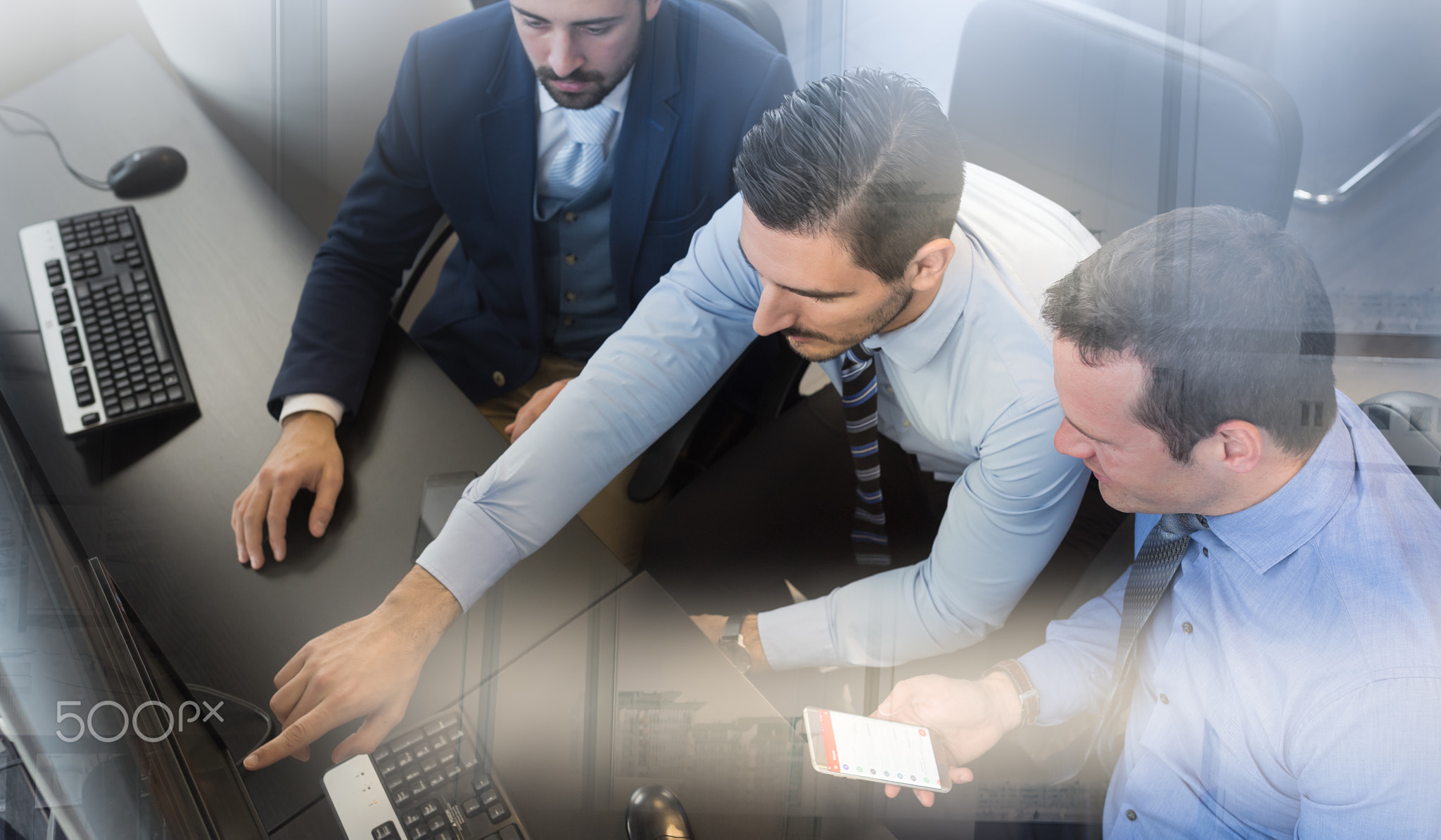 Business team analyzing data on computer.