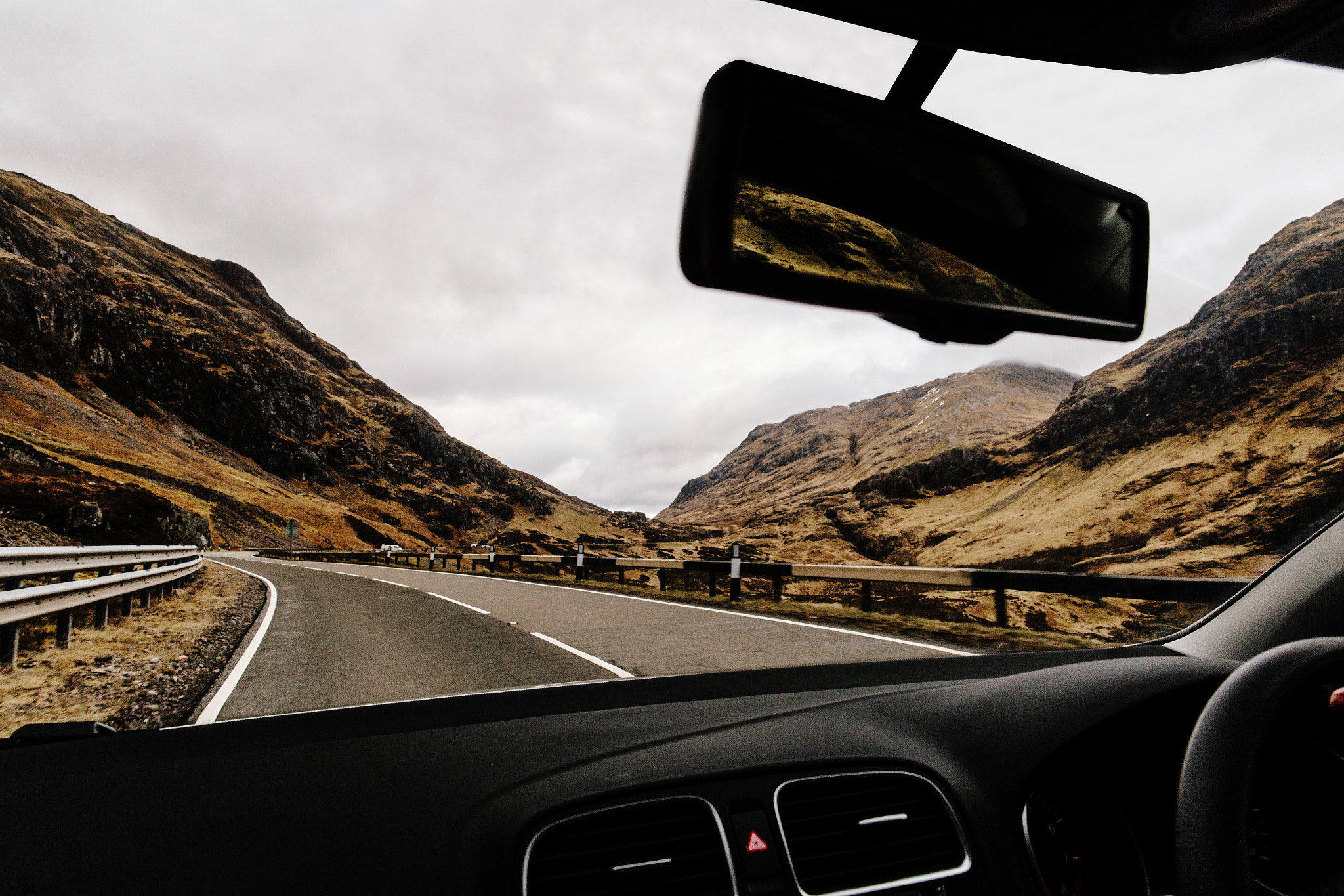 Car driving through Glencoe, Scotland