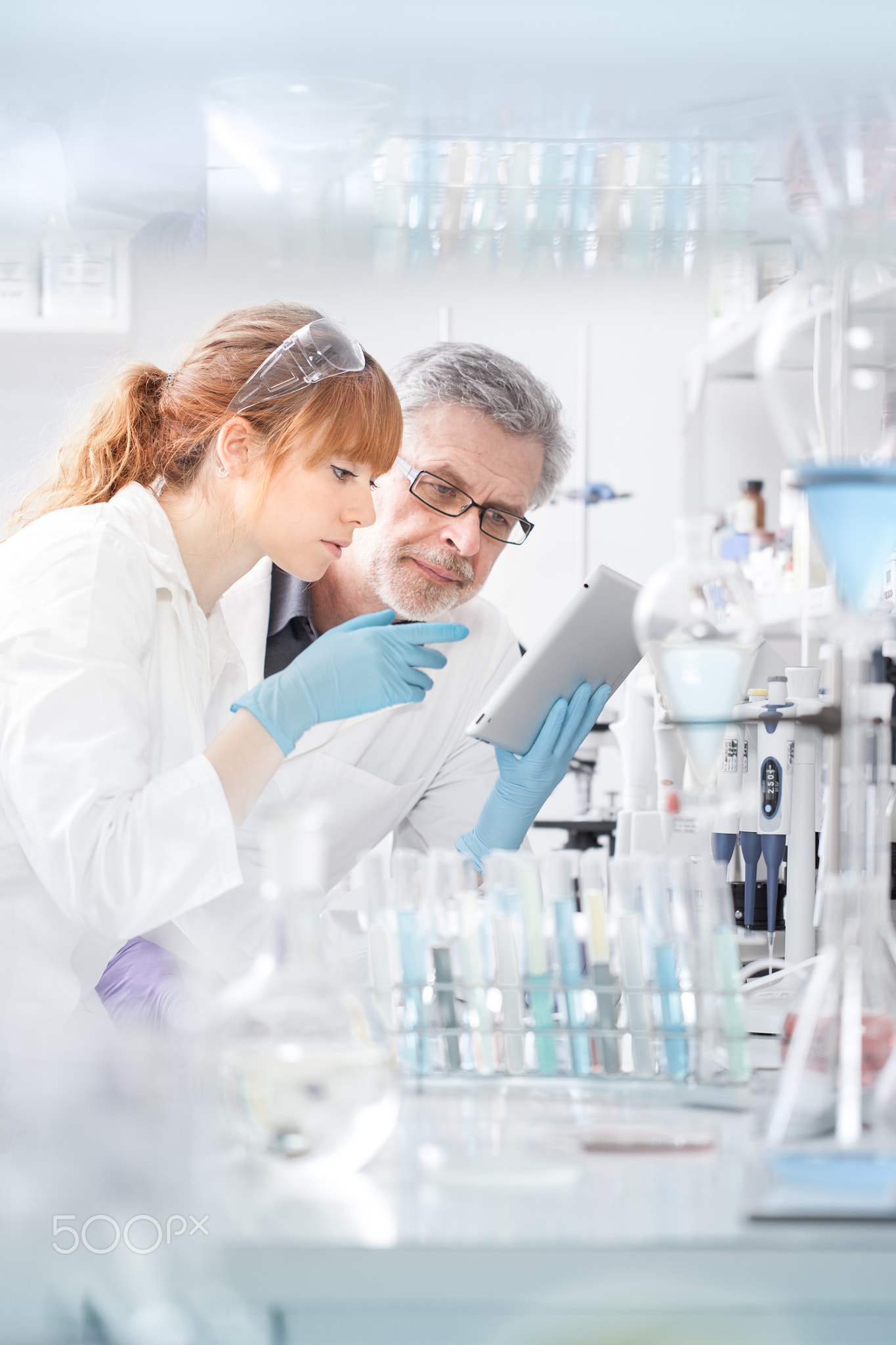 Health care researchers working in scientific laboratory.