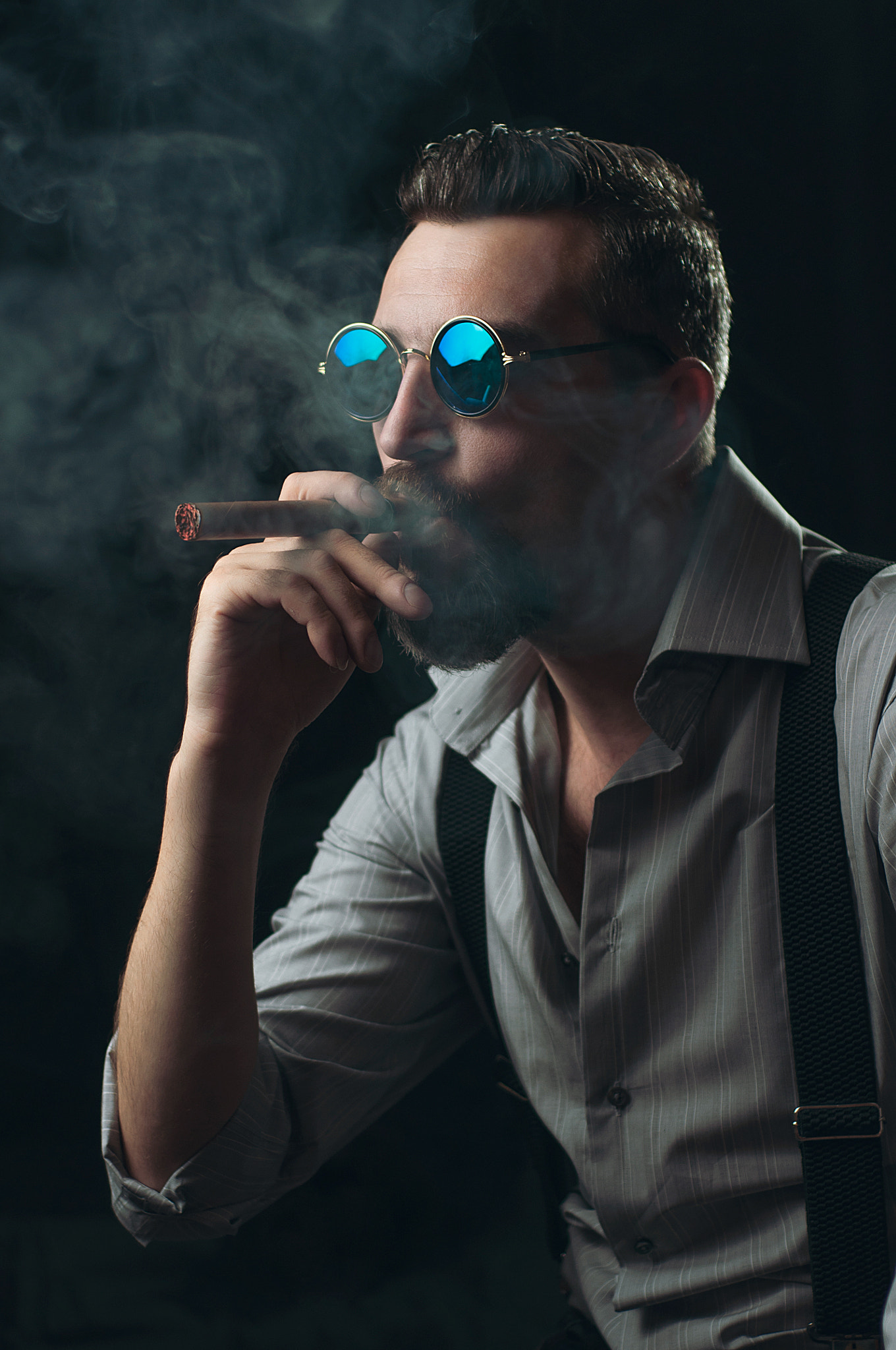 A man who smokes a cigar