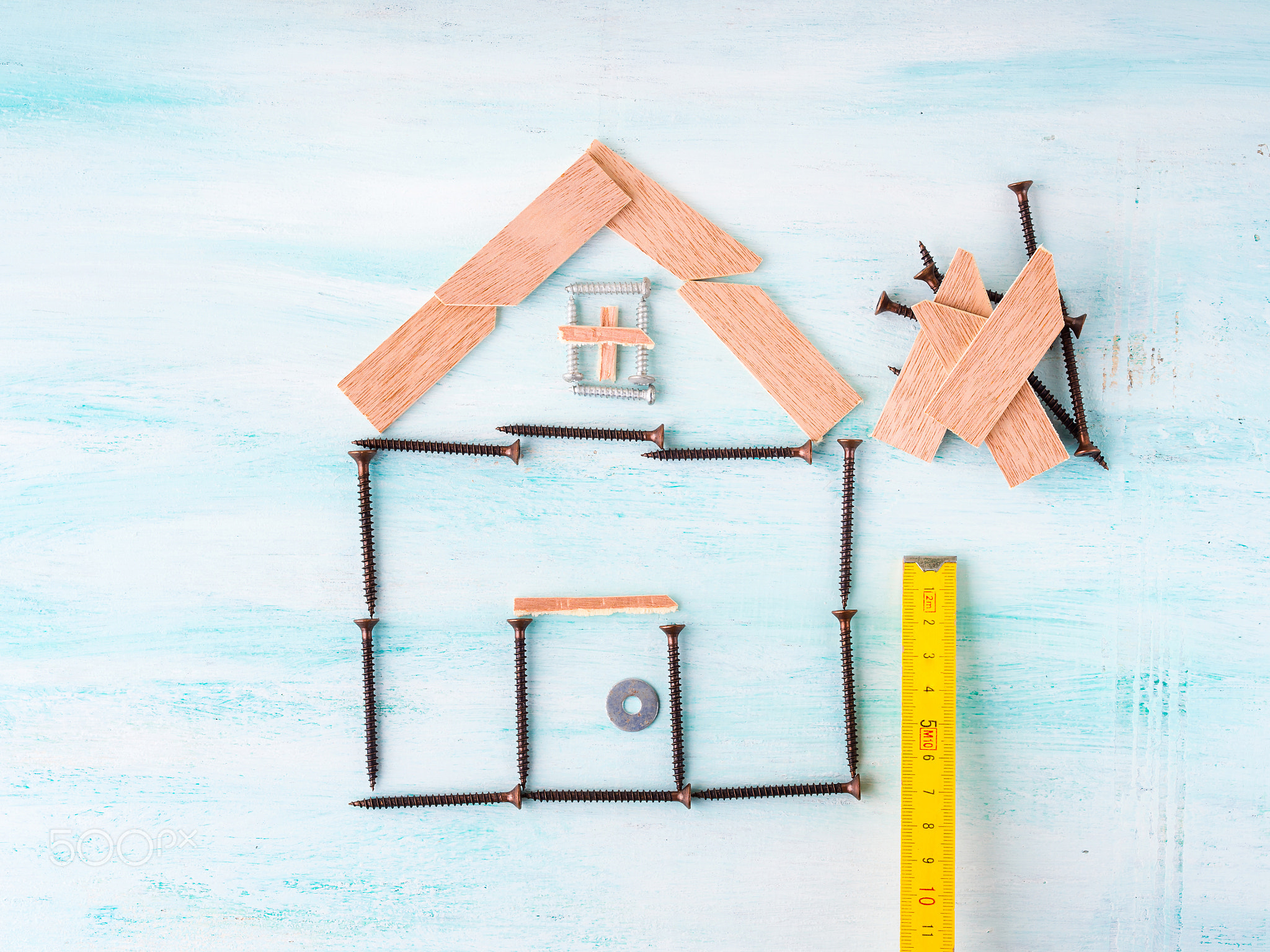 Building house concept flat lay with screw and wood