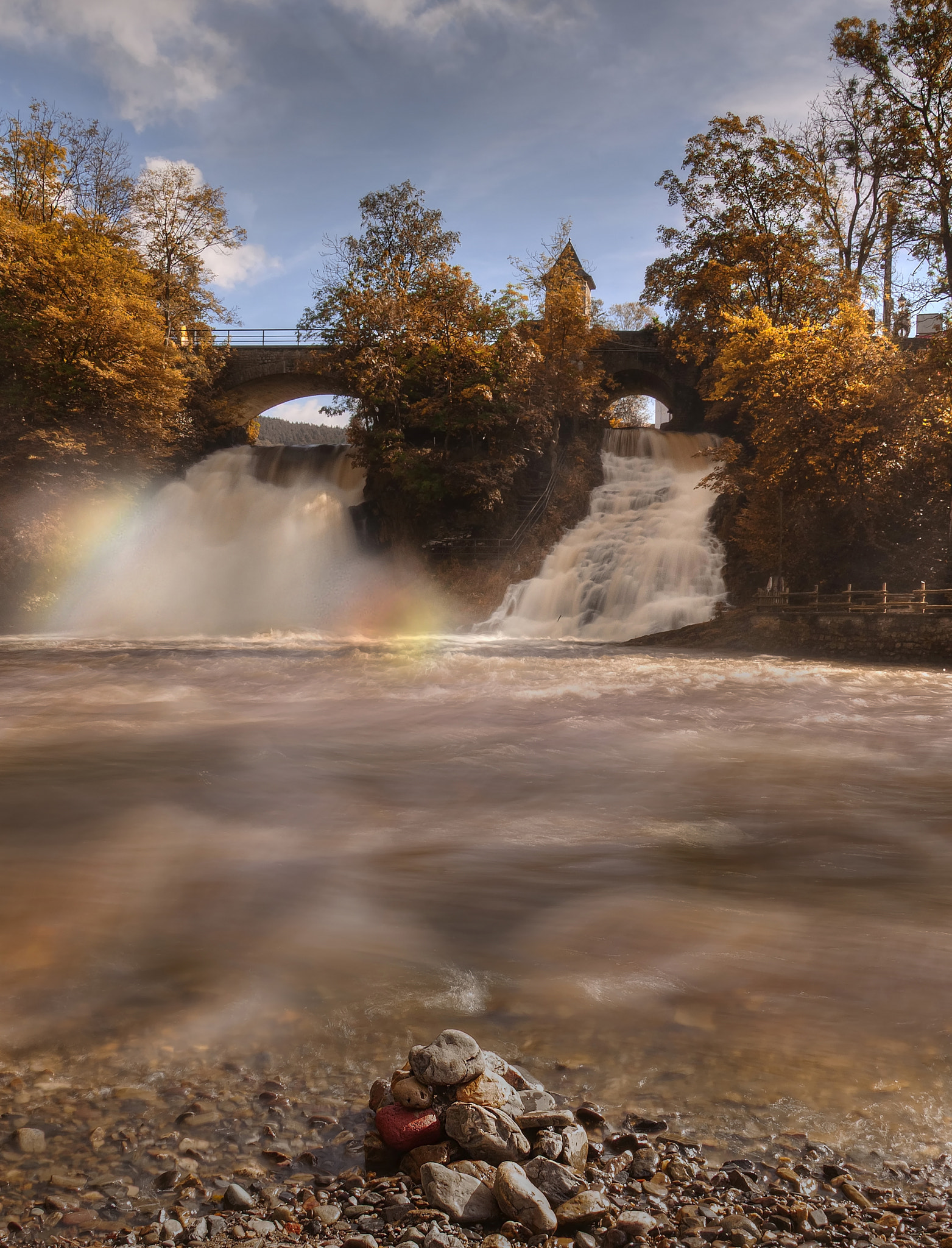 coo waterfall and the sun make a colorful picture