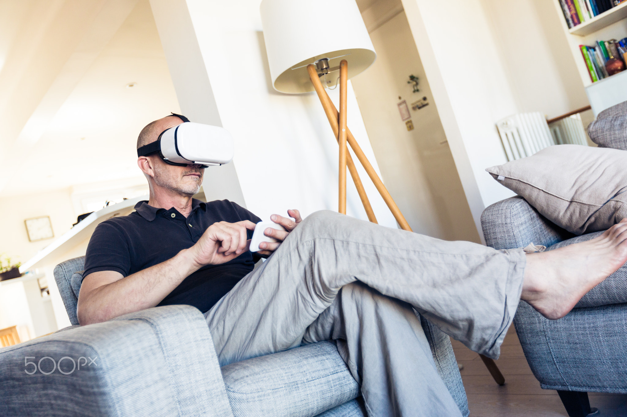 Adult Man Using Vr Goggles At Home