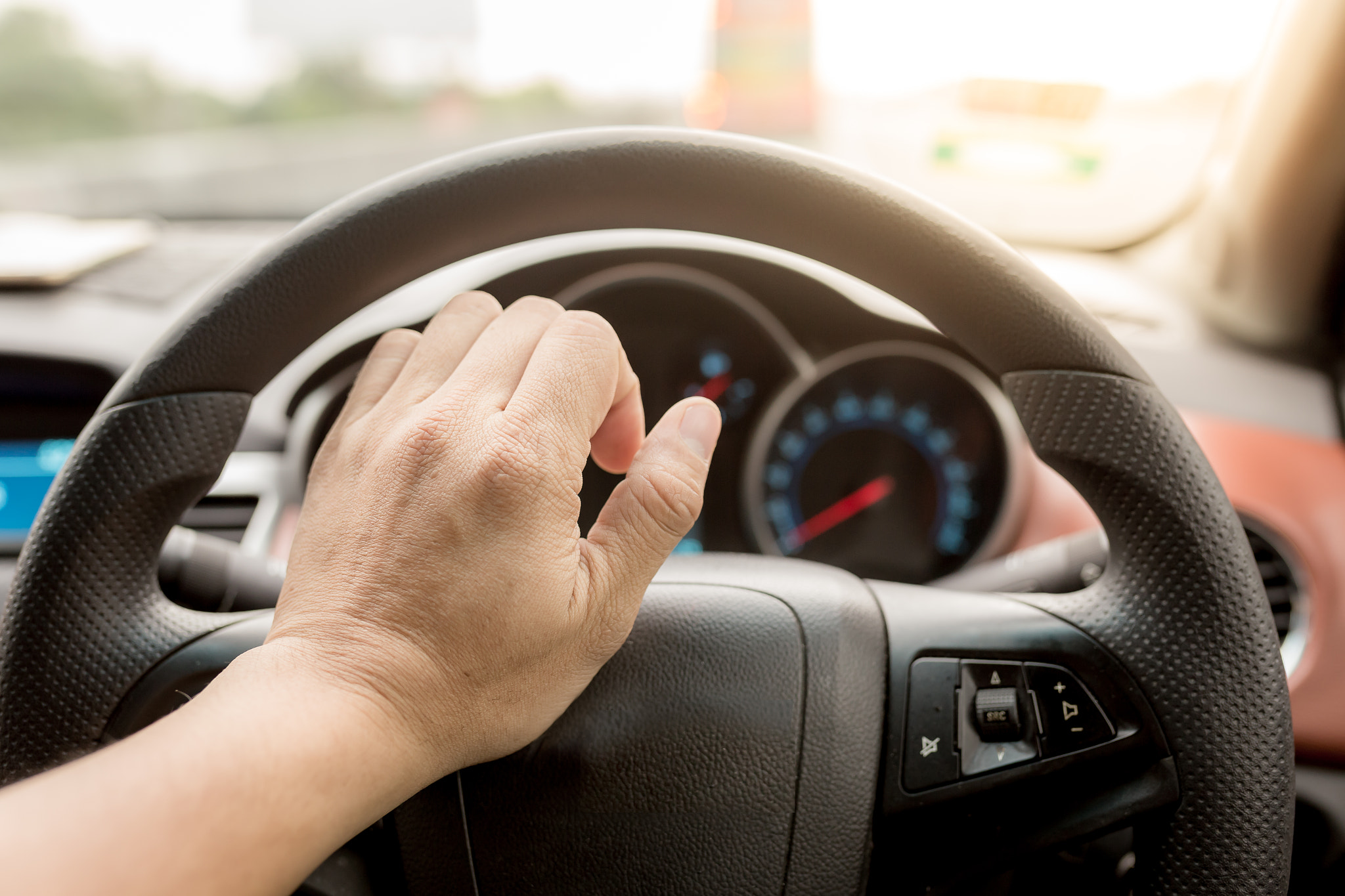 Beeping car driver among traffic jam