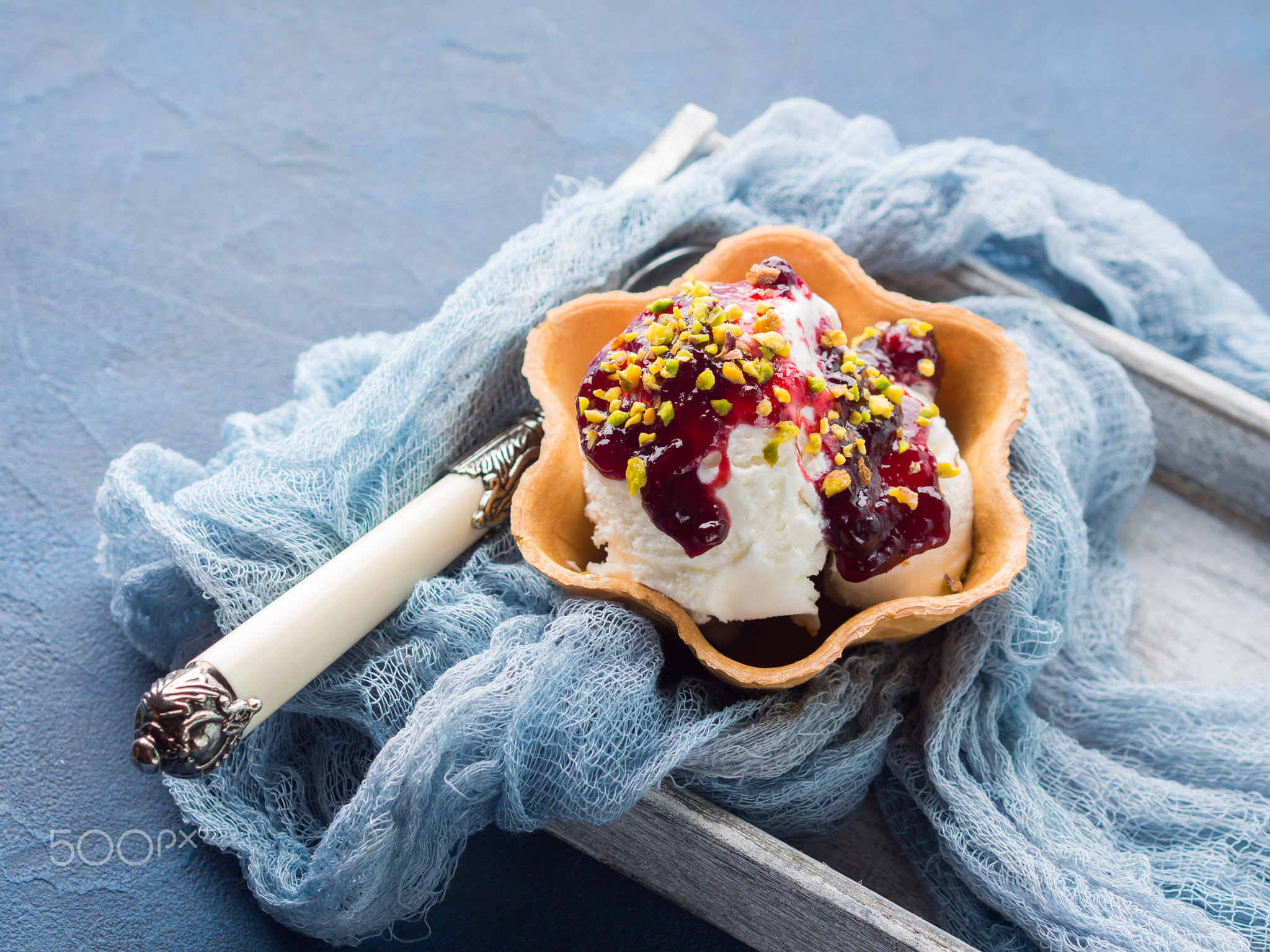 Vanilla ice cream scoops in waffle cup