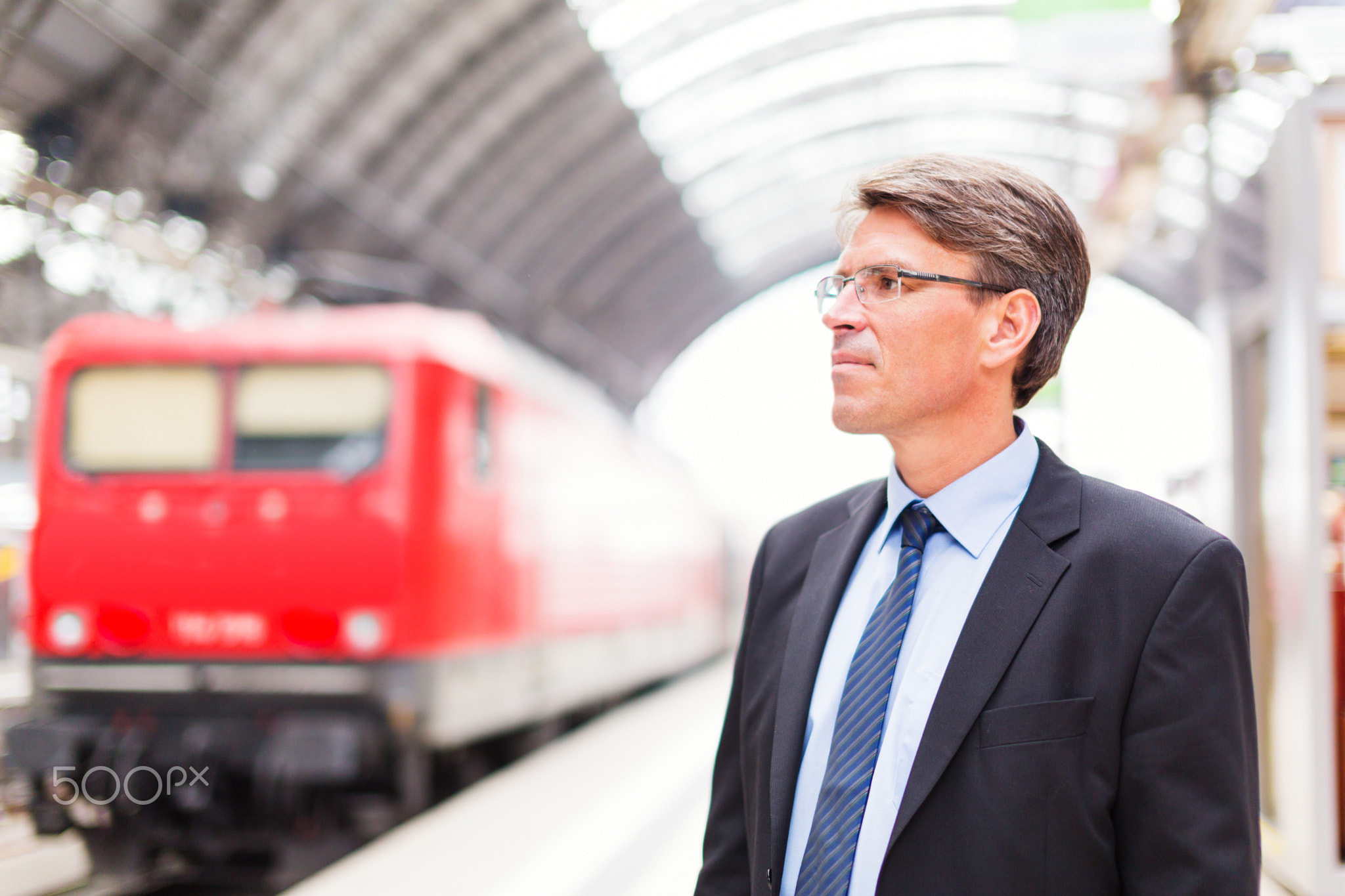 Businessman In Train Station