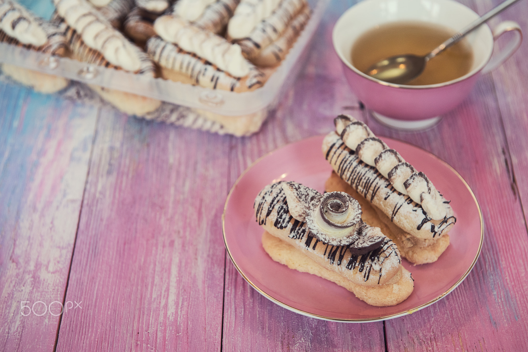 cakes on color background