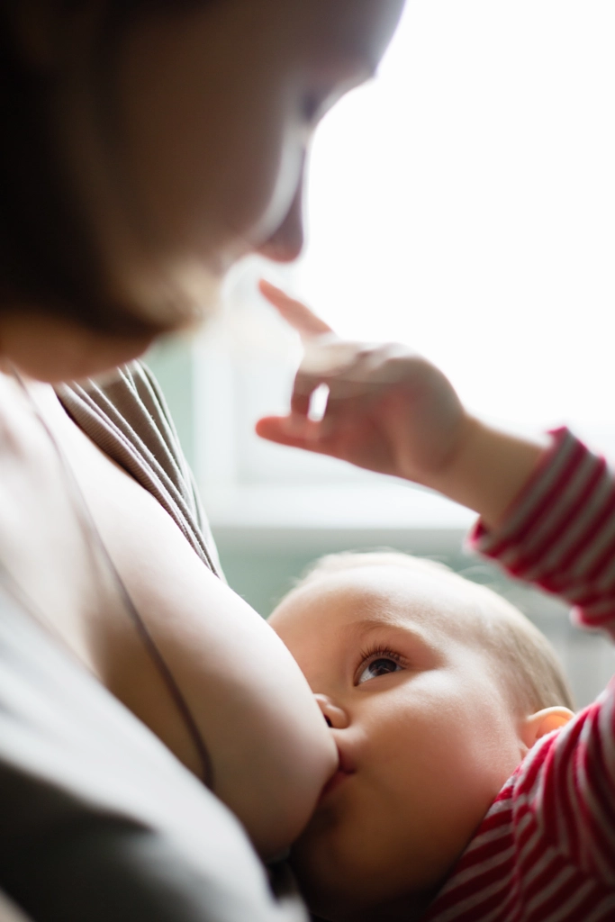 Woman breastfeeding her child by Konstantin Kolosov on 500px.com