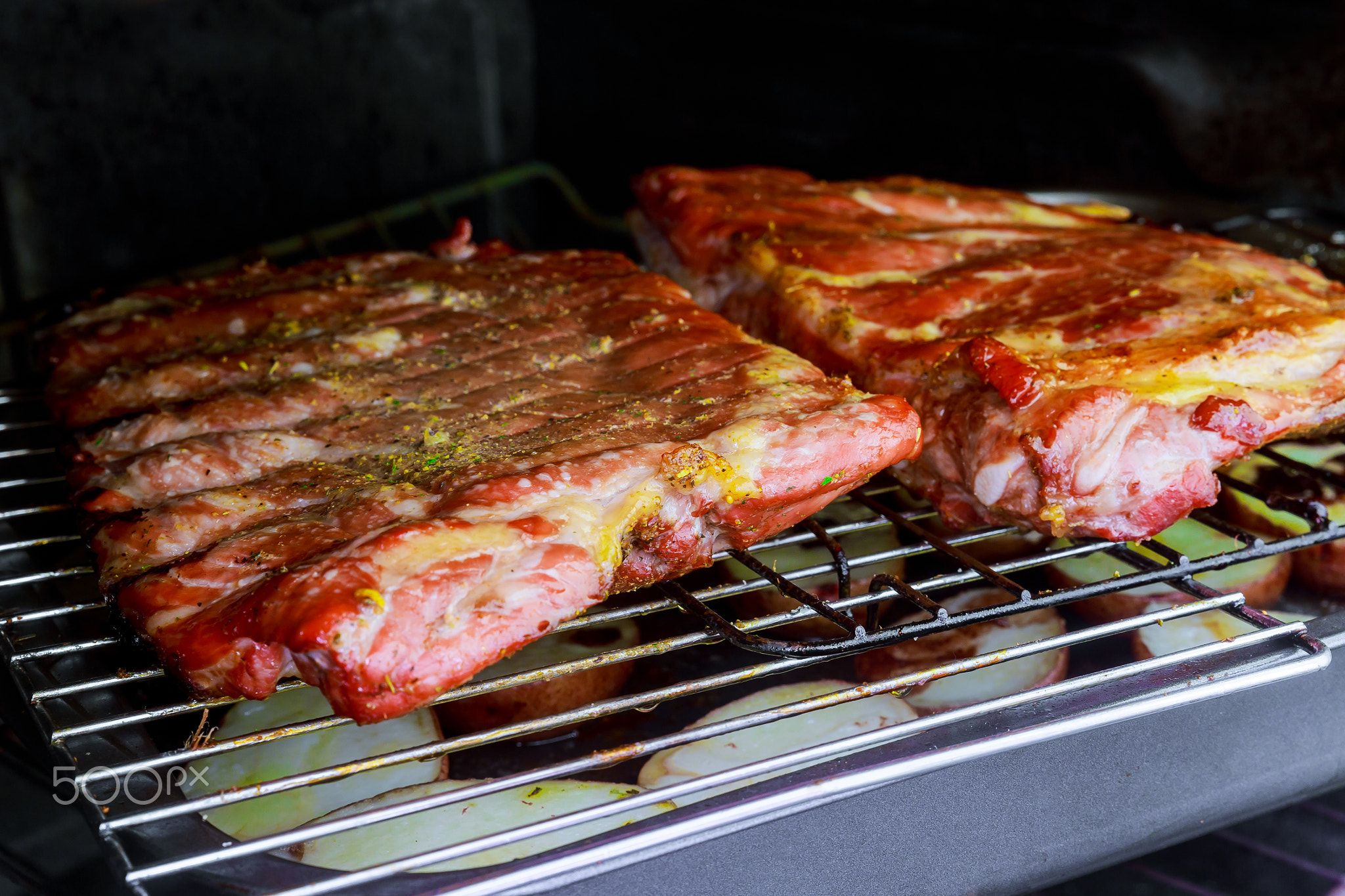 pork ribs and potatoes in the oven