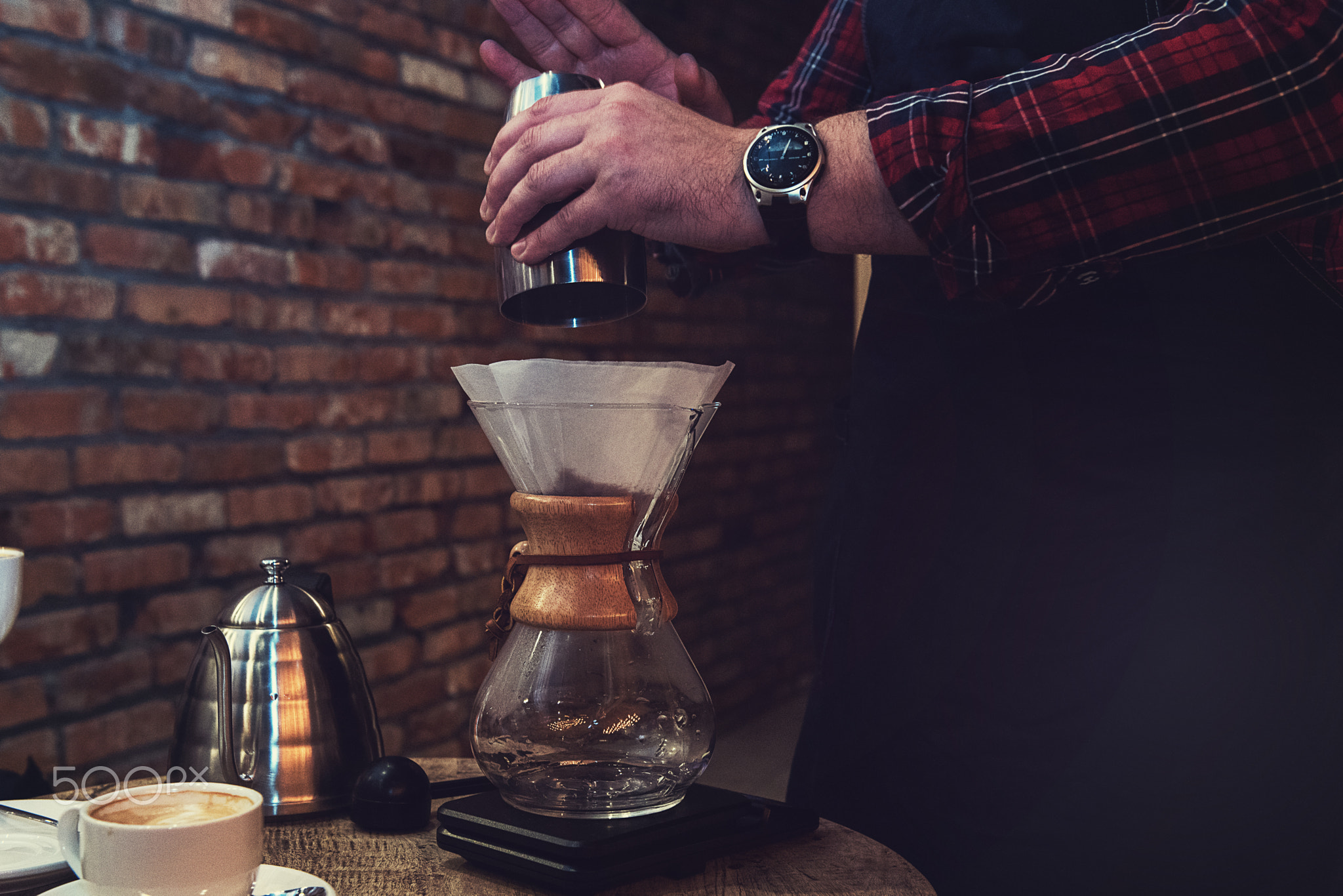 Barista brewing coffee