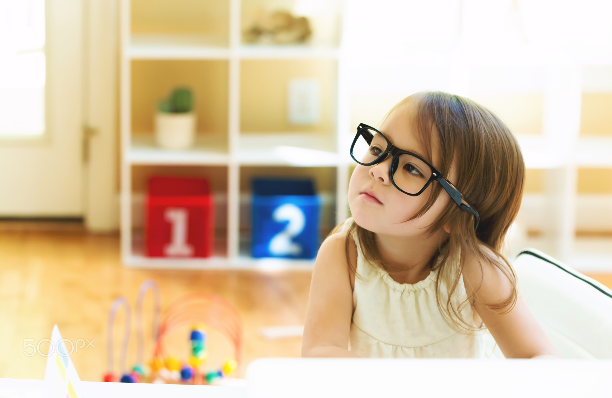 Toddler girl wearing glasses