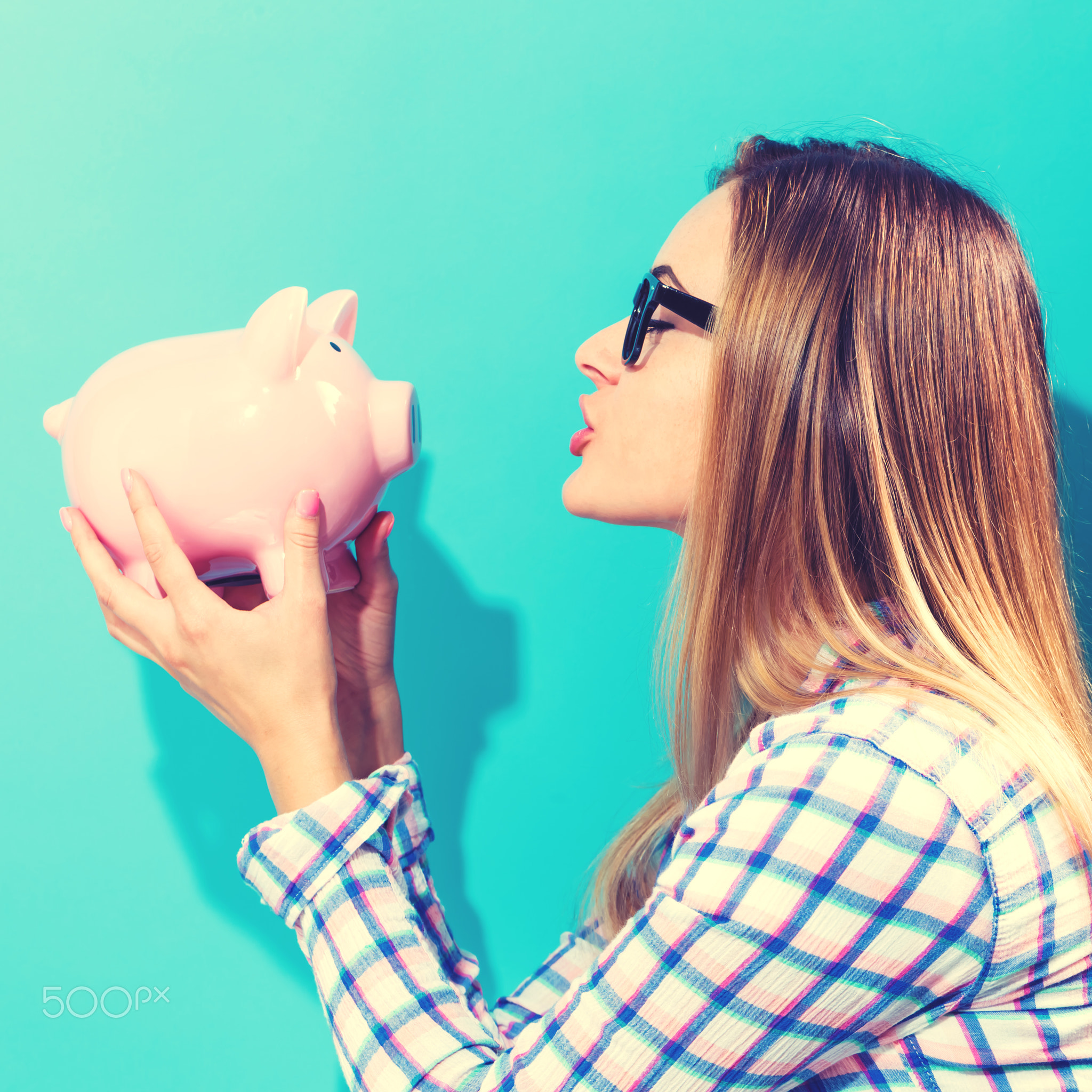 Woman holding piggy bank