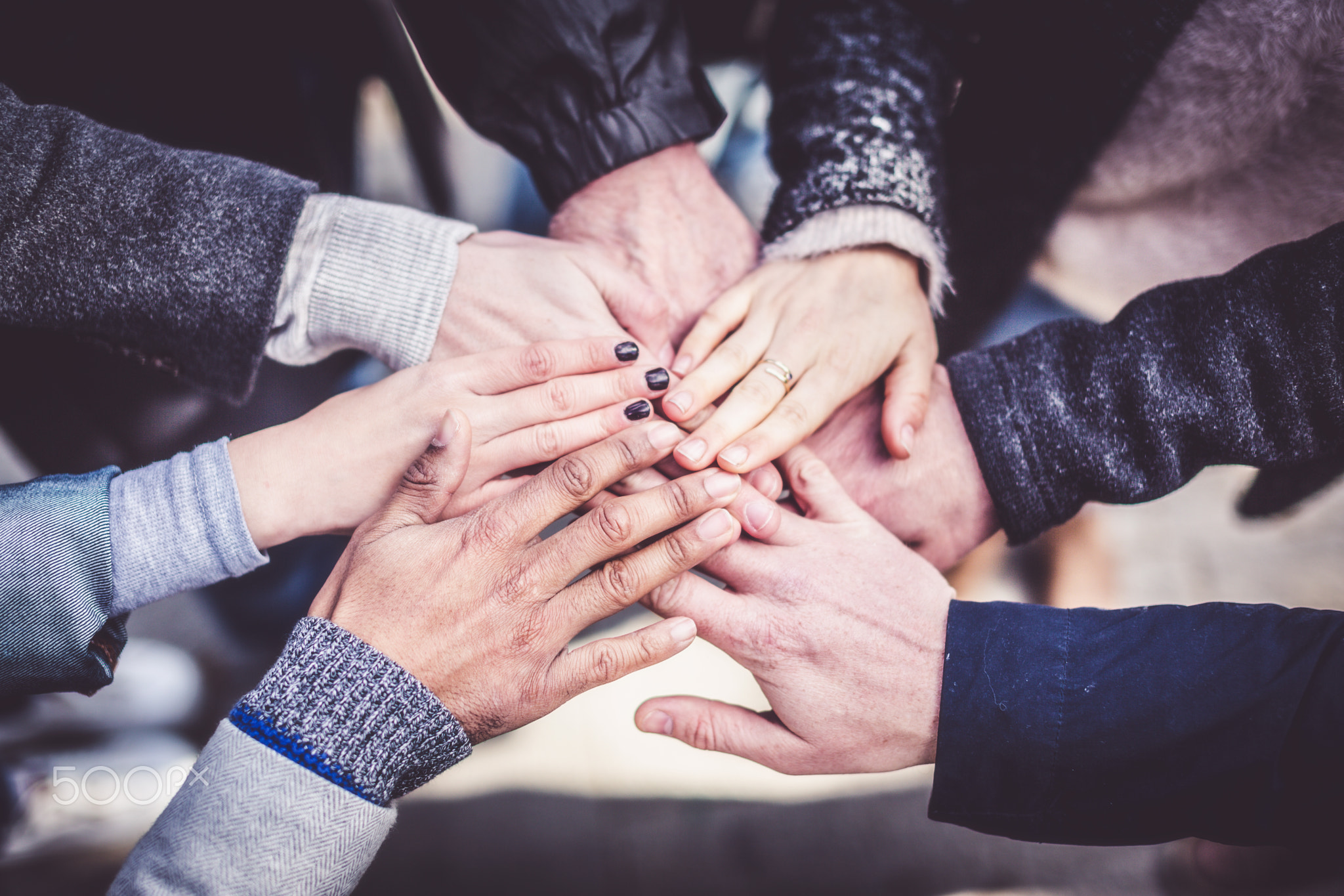 Seven Adults' Hands Together