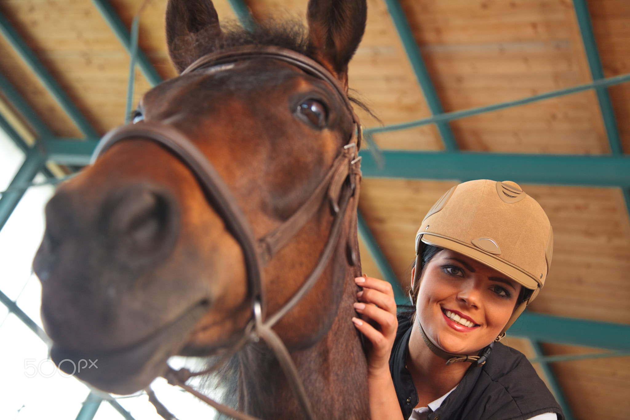 Woman In Indoor Riding Arena