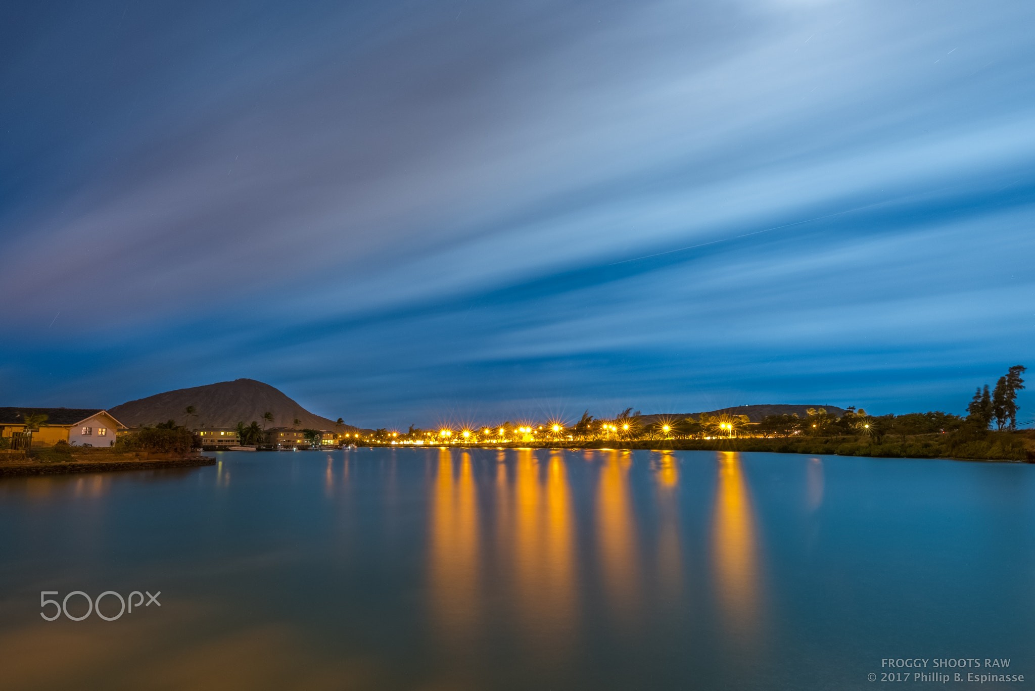 Tropical island water reflections under moonlight