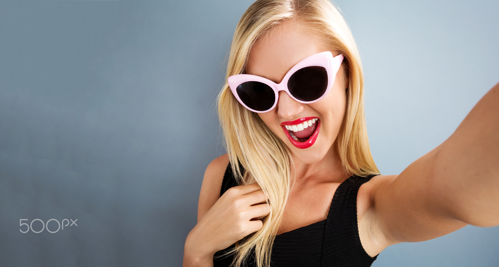 Young woman taking a selfie
