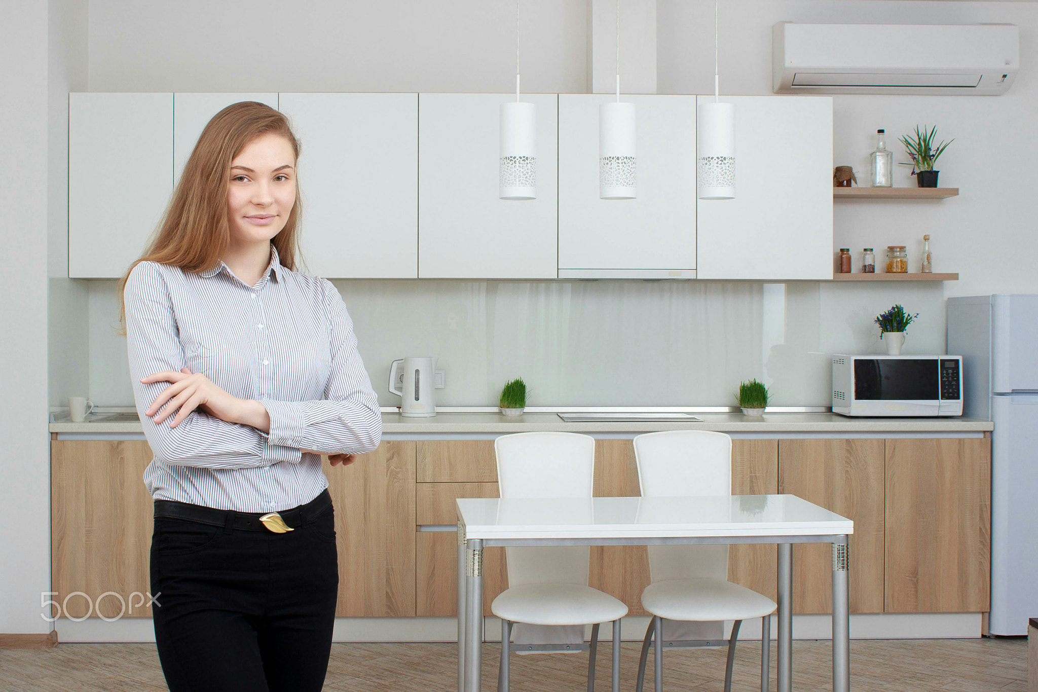 Realtor in dinner room proposes to view a flat - real estate.