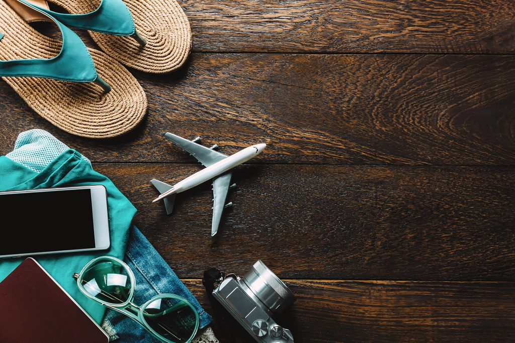 Top view accessories travel with mobile phone,camera,sunglasses by CHATTRAWUTT HANJUKKAM on 500px.com