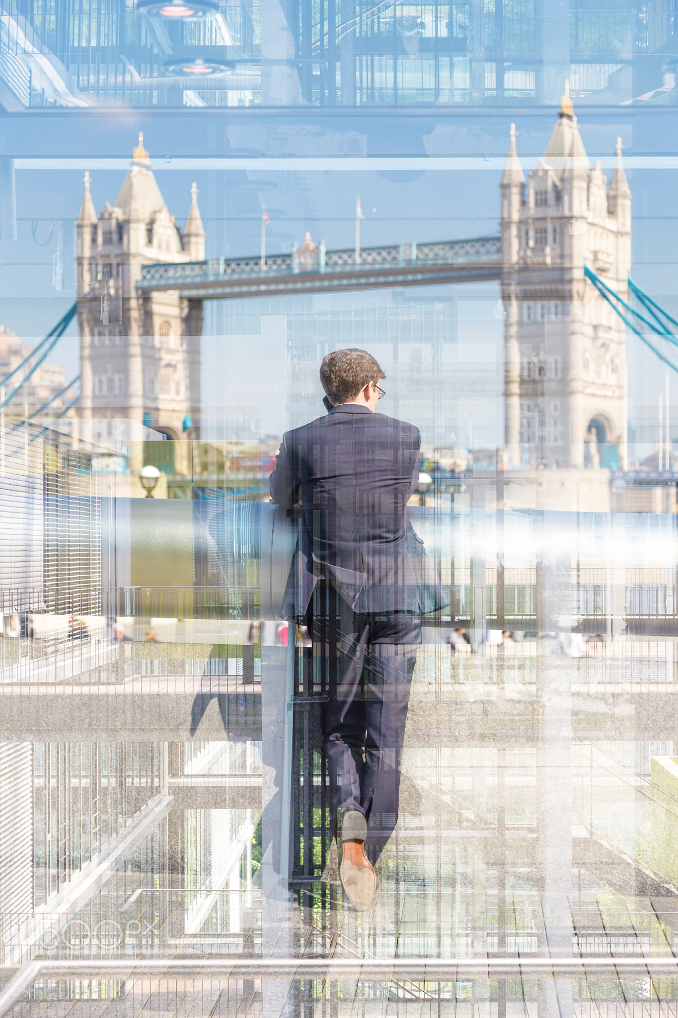 British businessman talking on mobile phone in London city, UK.