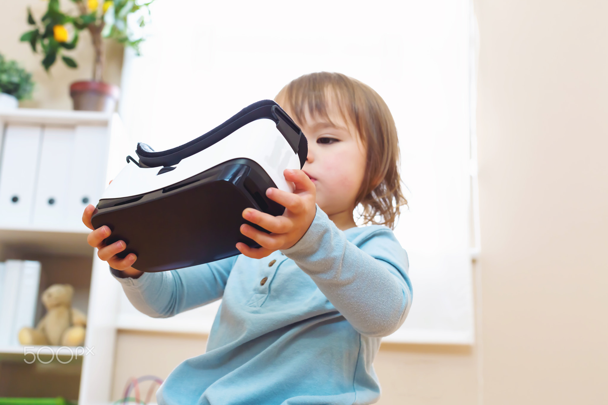 Toddler girl using a virtual reality headset