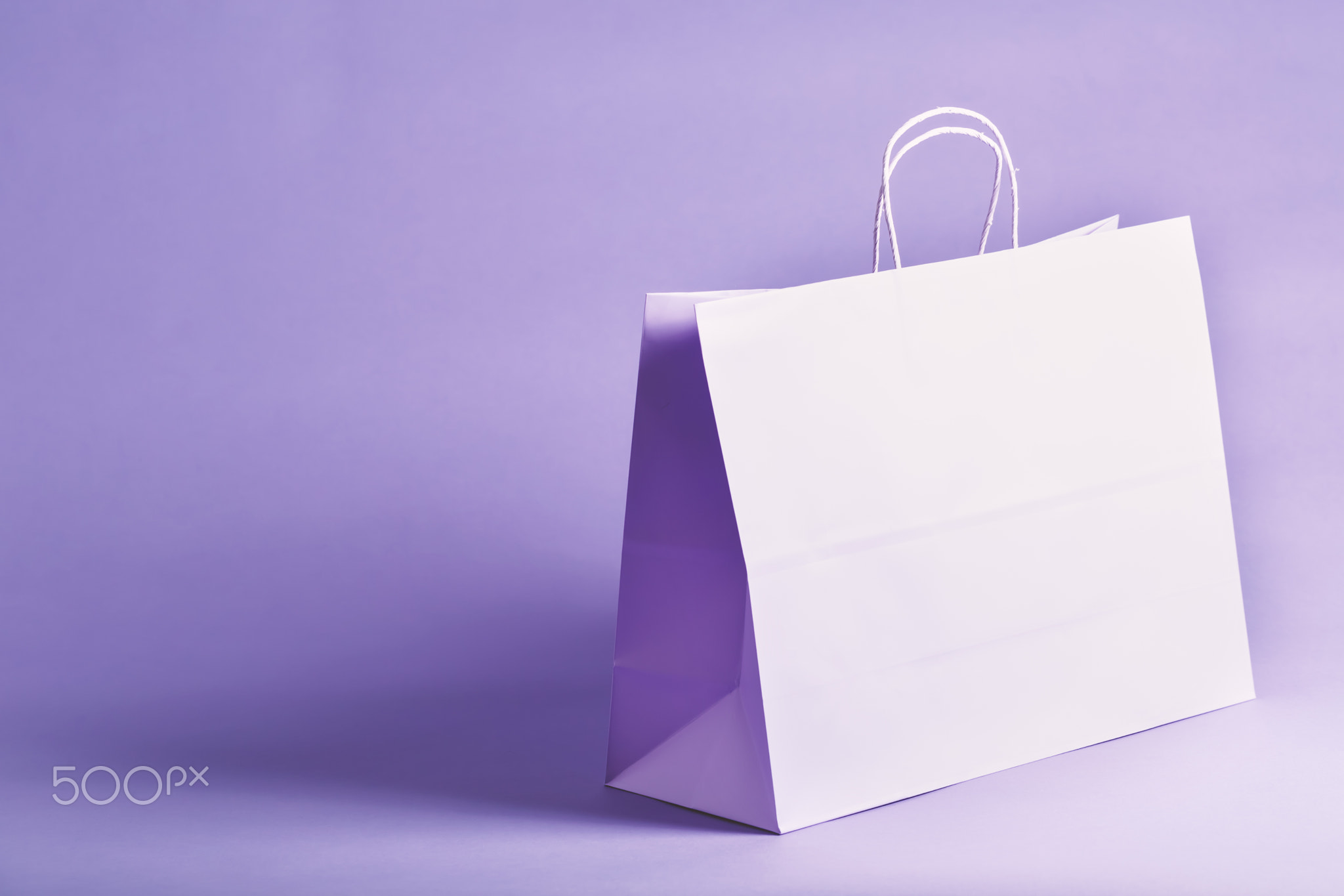 Purple gift bag on a vibrant background