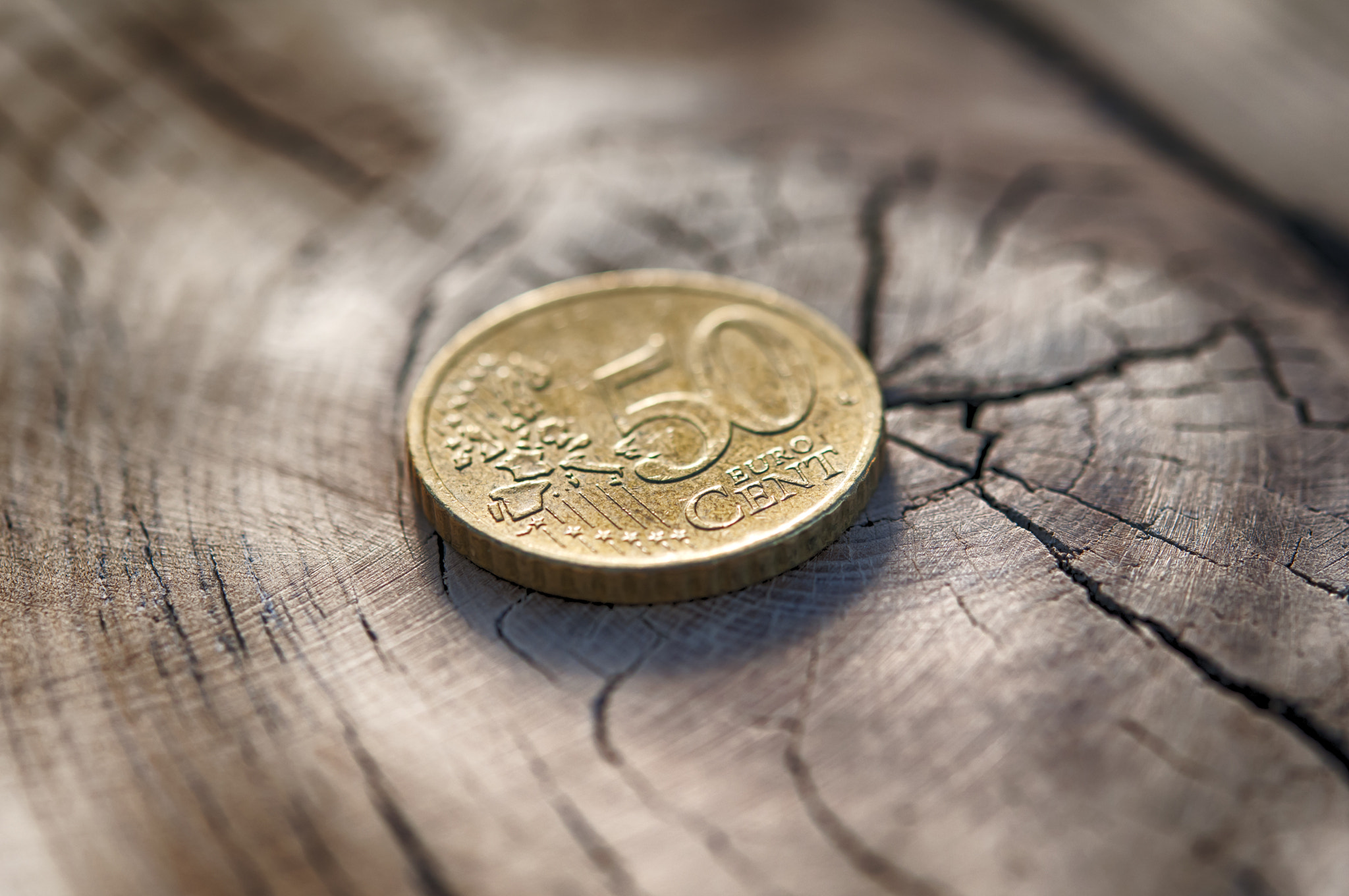 euro coin on wood table