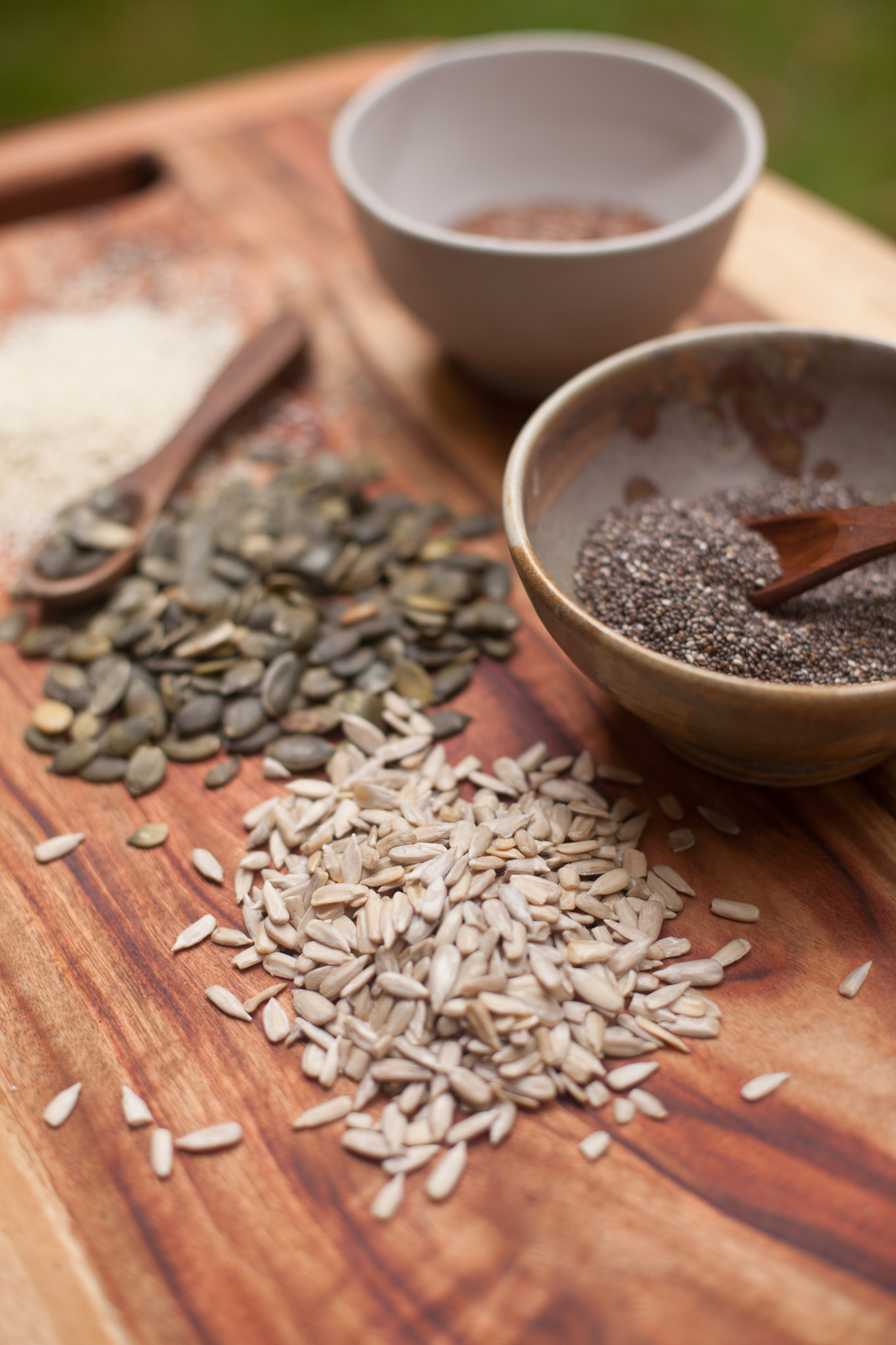 mixed seeds on wooden background