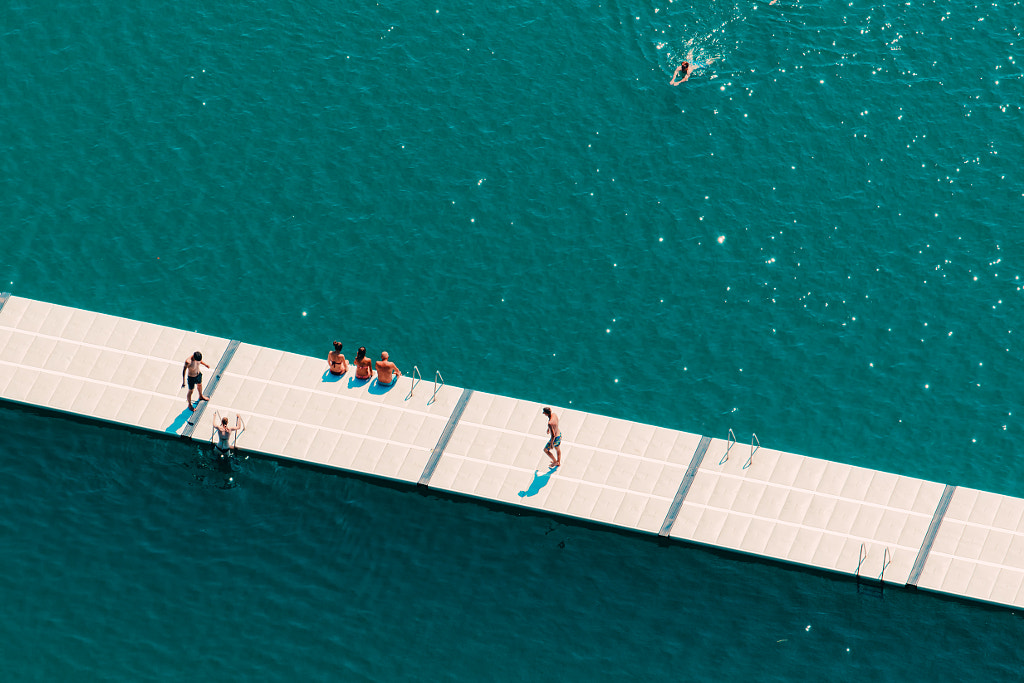 Unrecognizable people enjoying summer afternoon on lake by Igor Stevanovic on 500px.com