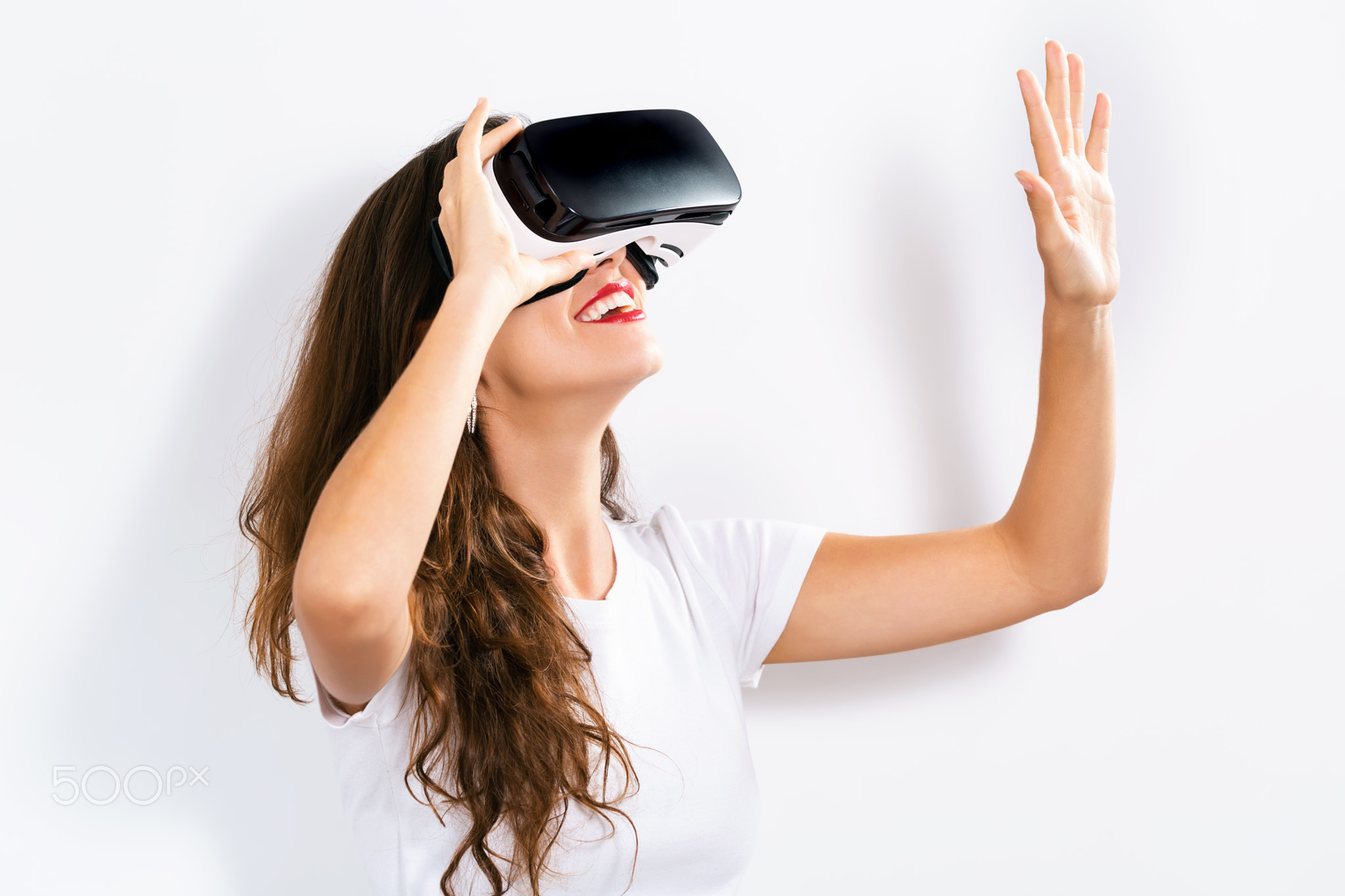 Young woman using virtual reality headset