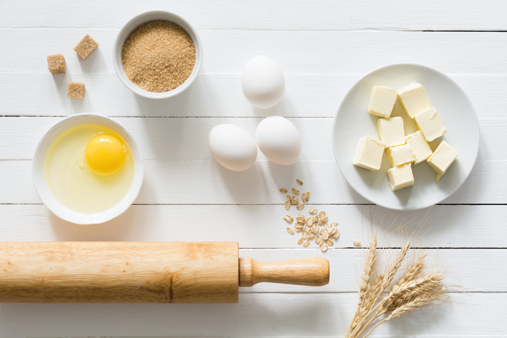 Baking cake or cookies ingredients on white wooden table top view by Vladislav Nosick on 500px.com